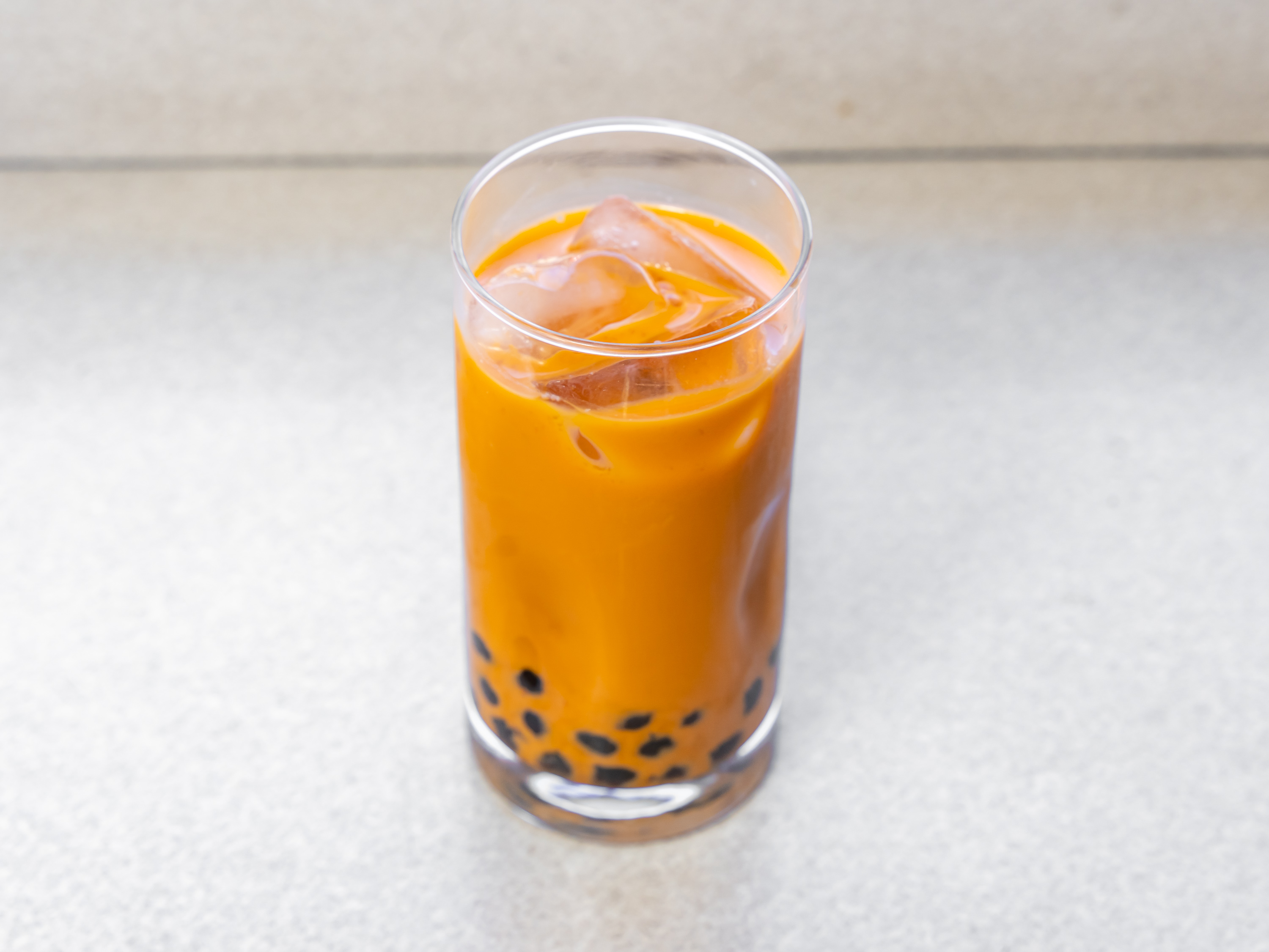 Order Thai Tea food online from Glaze Donuts And Bagel Sandwiches store, San Francisco on bringmethat.com