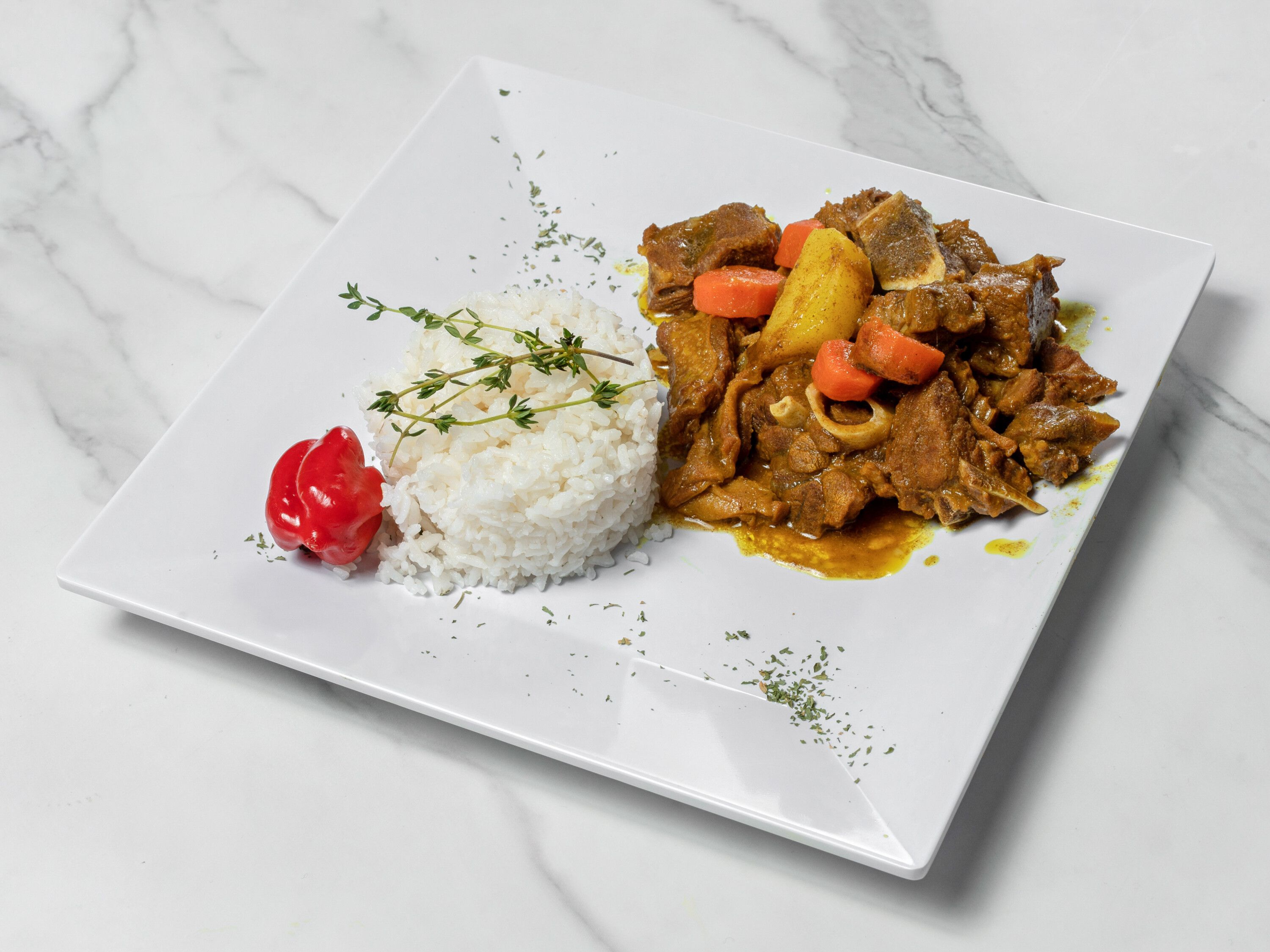 Order Curry Goat food online from Culcha Caribbean Cuisine store, Haledon on bringmethat.com