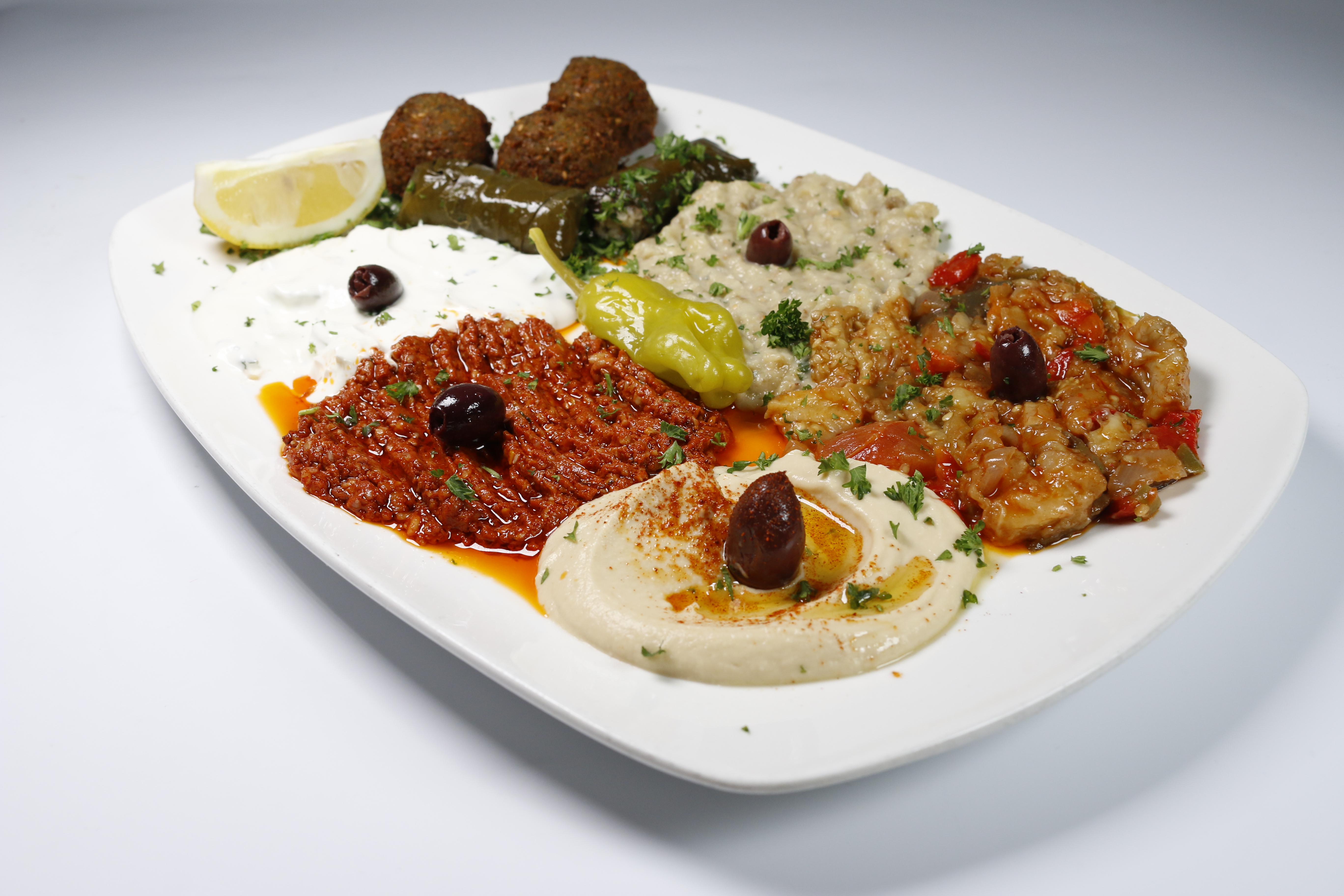Order Appetizer Combo Plate food online from Hummus Mediterranean Kitchen store, San Mateo on bringmethat.com