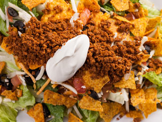 Order Deluxe Taco Salad food online from Happy Joe Pizza & Ice Cream Parlor store, Coal Valley on bringmethat.com