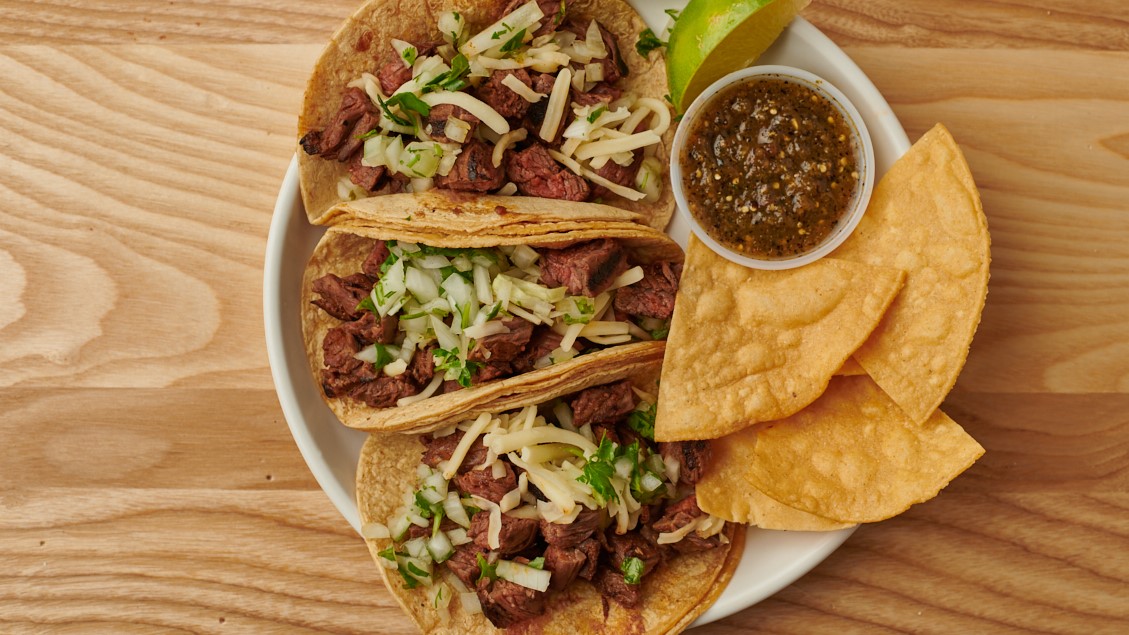 Order CARNE ASADA TACOS food online from Burrito Beach store, Chicago on bringmethat.com