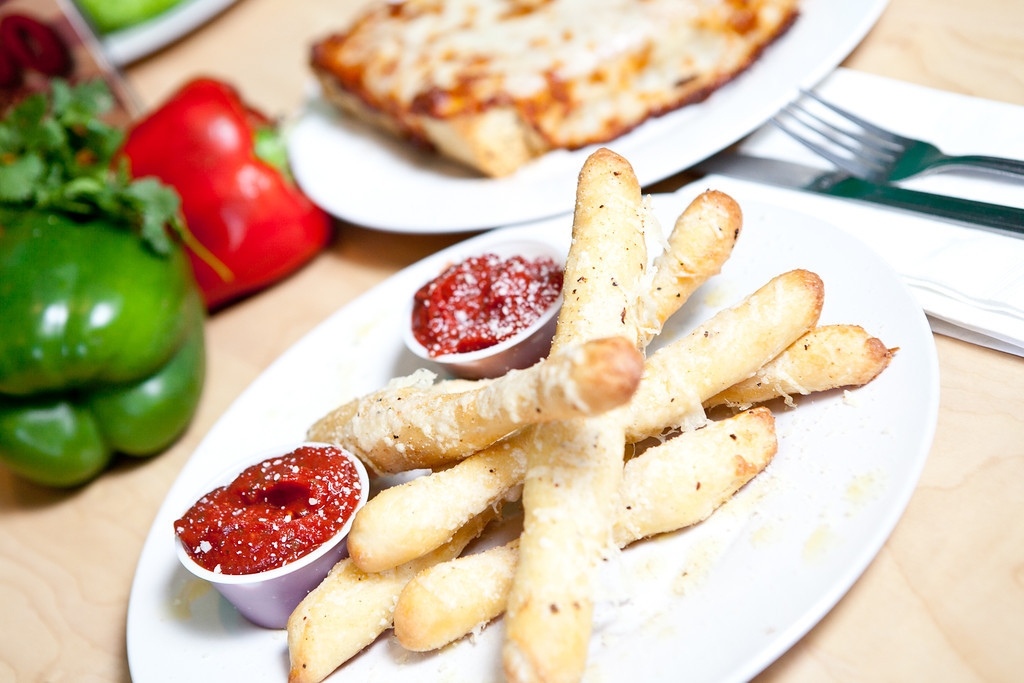Order PARMESAN GARLIC STICKS food online from Sergeant Pepperoni's Pizzeria store, Knoxville on bringmethat.com