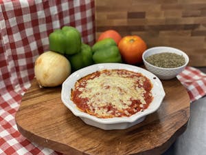 Order Veal Parm with Spaghetti food online from Manny & Olga Pizza store, Washignton on bringmethat.com