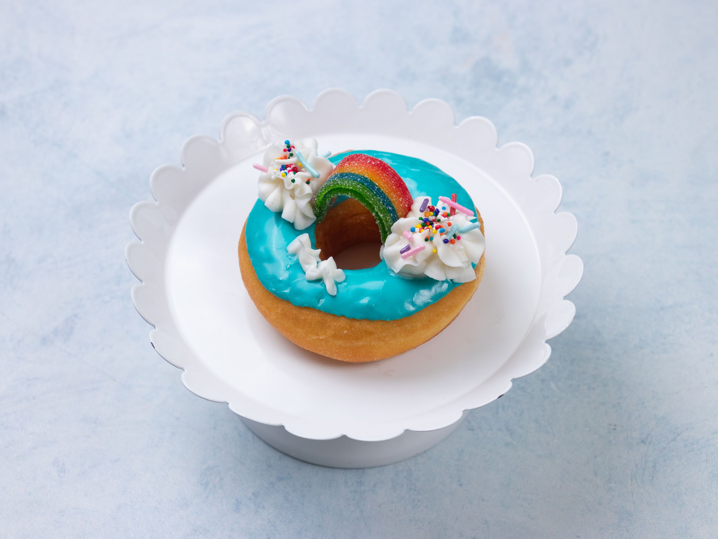 Order Design Donut (Rainbow) food online from Joy Donuts store, Dacula on bringmethat.com