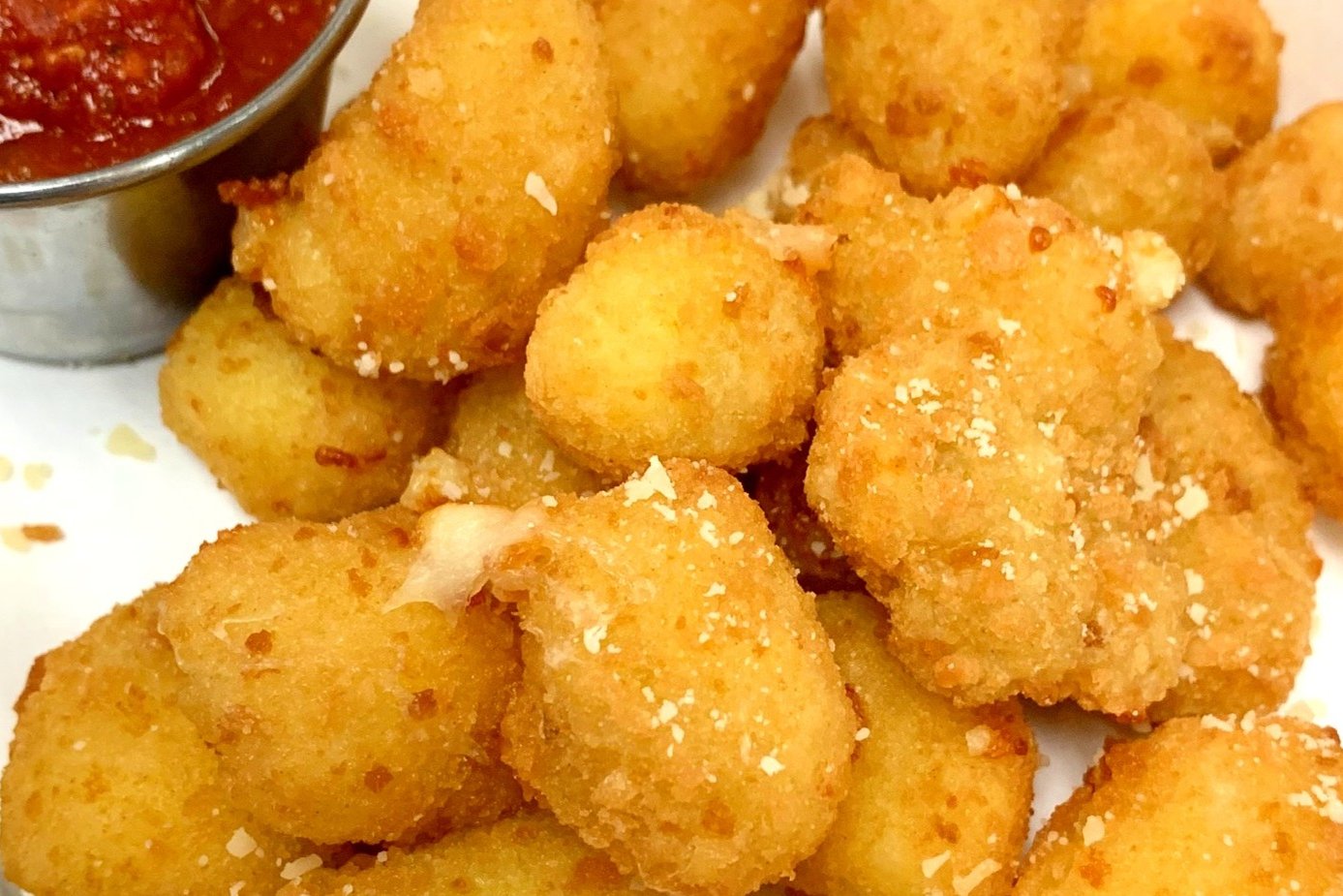 Order Breaded Mozzarella Balls (Cheese Curds) food online from Brooklyn Burgers & Subs store, Los Angeles on bringmethat.com
