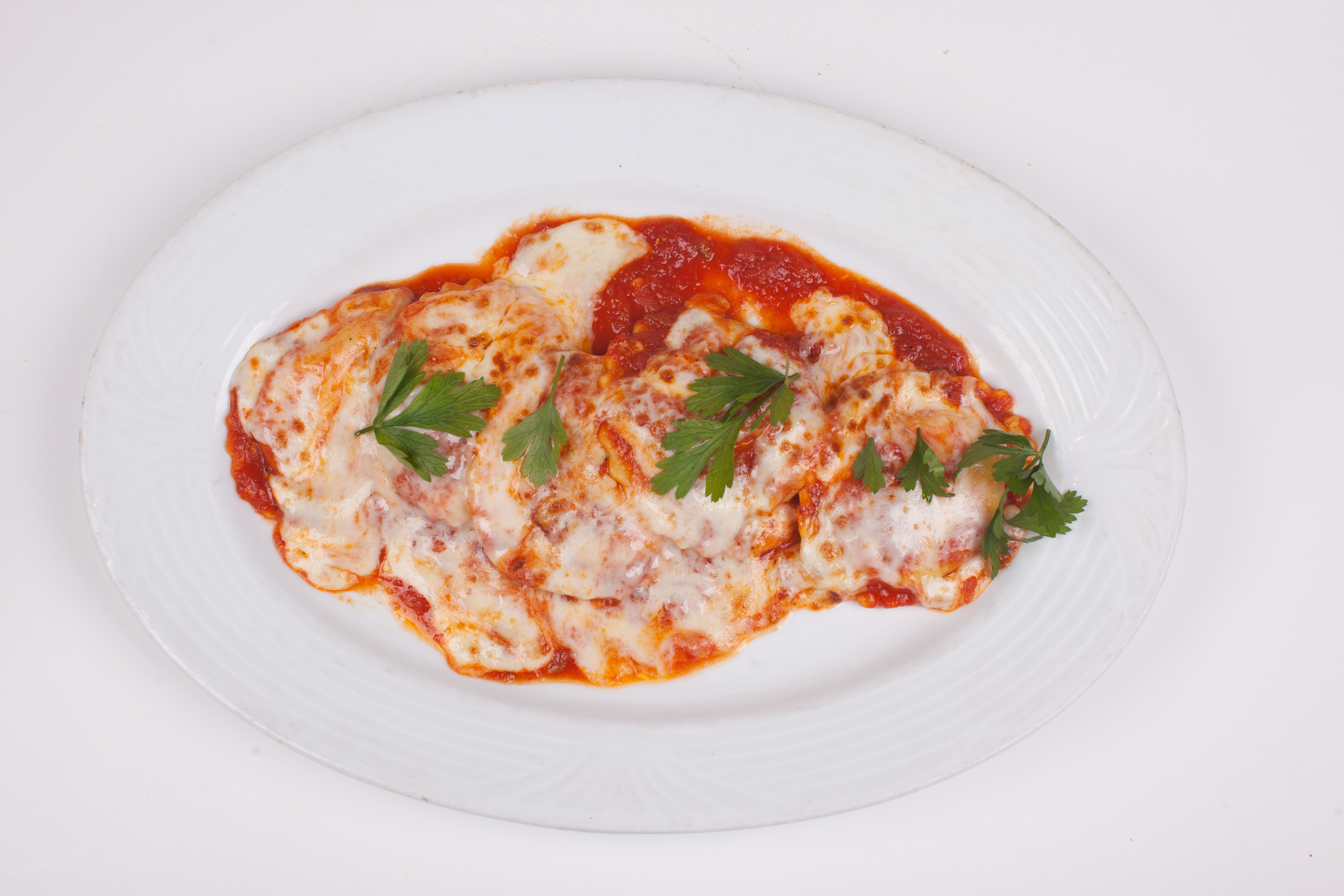 Order Baked Cheese Ravioli food online from Umberto Pizzeria store, Bellmore on bringmethat.com