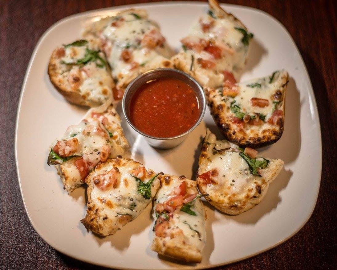 Order Garlic Bread with Cheese - Appetizer food online from Zeko's Italian Restaurant store, Whiteville on bringmethat.com