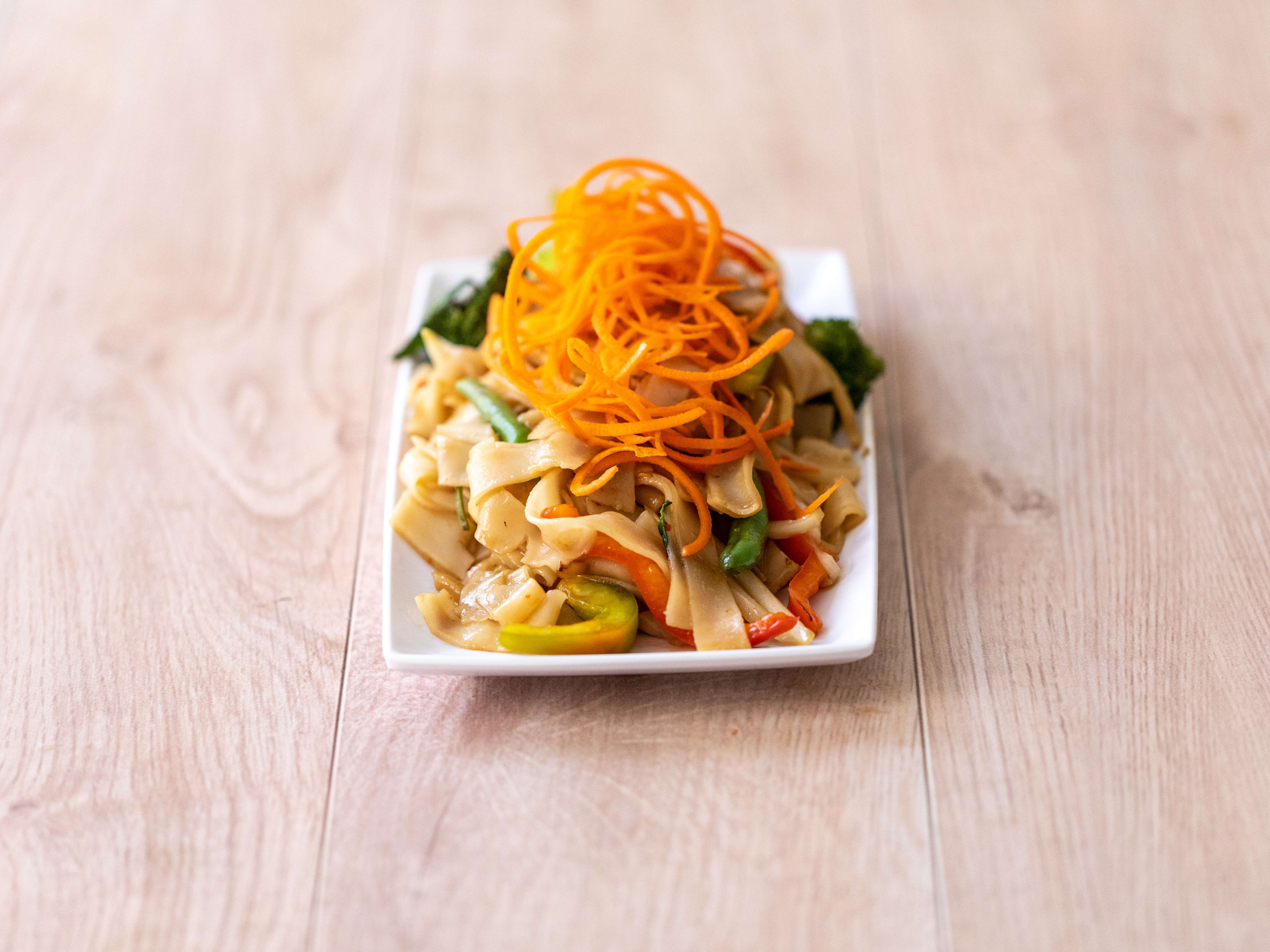 Order V0. Pad Kee Mow food online from Thai Idea Vegetarian store, San Francisco on bringmethat.com