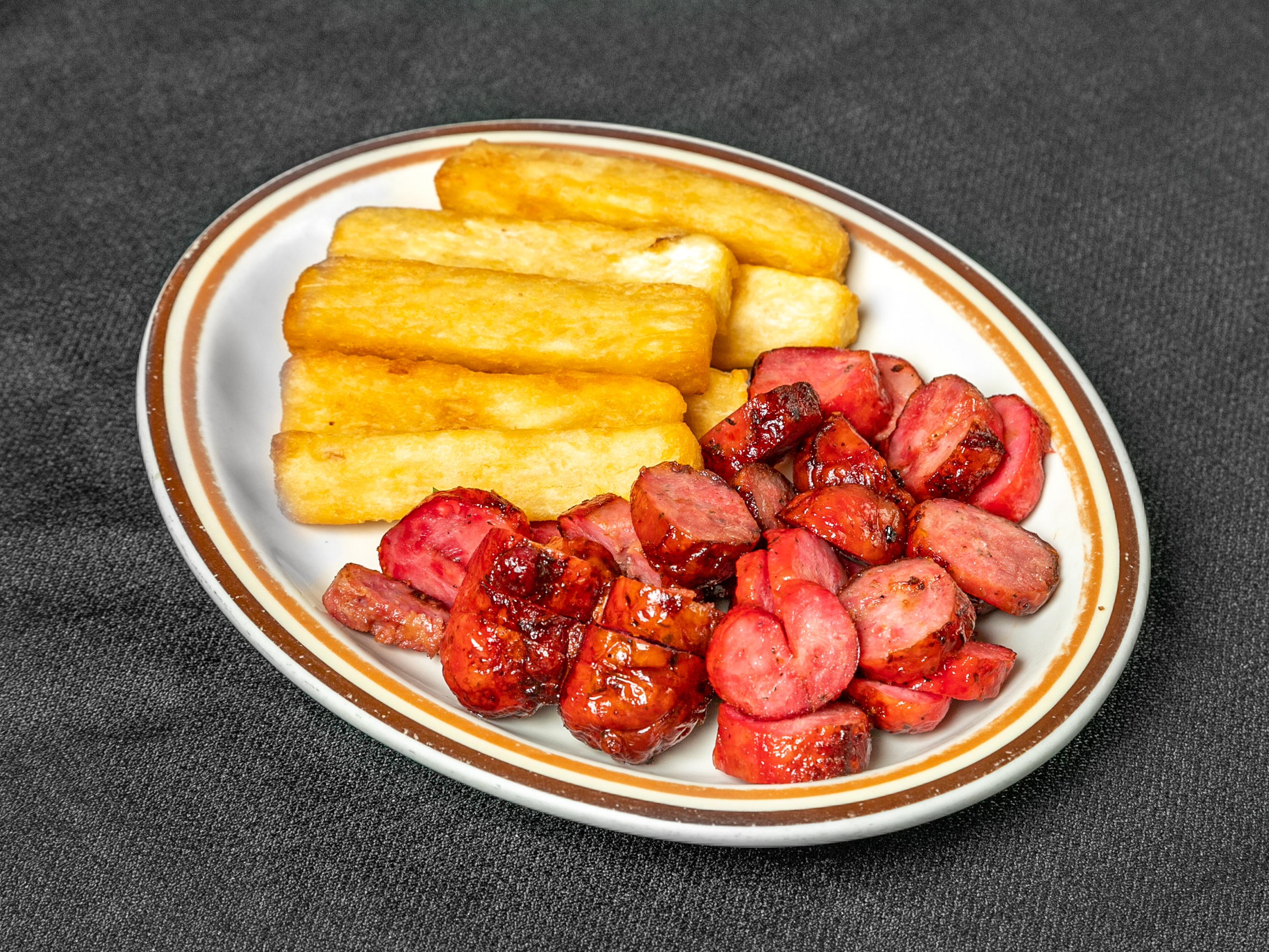Order Sausage with Onions and Yuca or Fries food online from Oliveiras Peabody store, Peabody on bringmethat.com