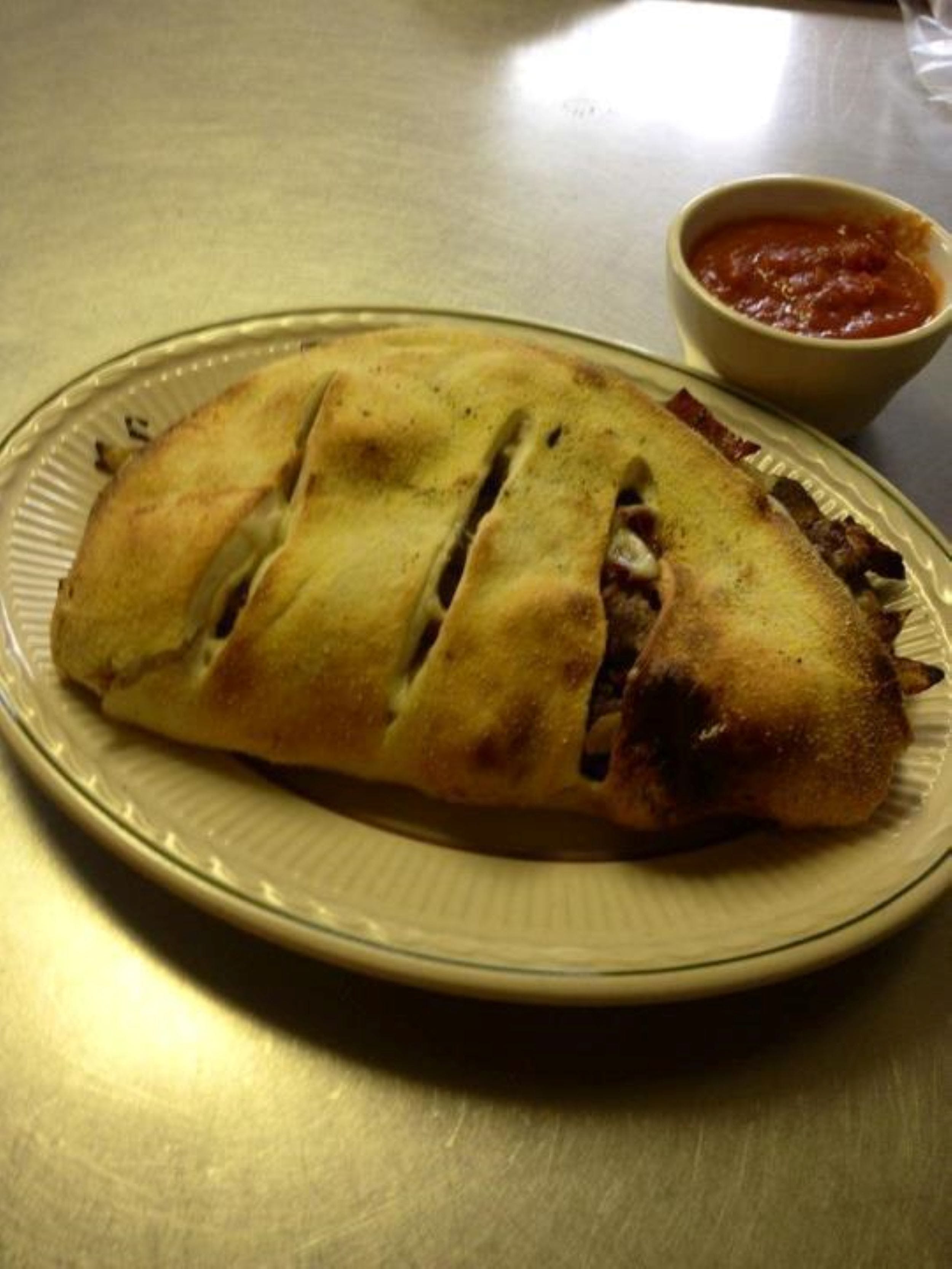 Order Steak Bomb Calzone - Calzone food online from Jitto's Super Steak store, Portsmouth on bringmethat.com