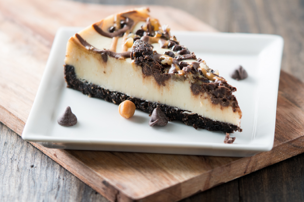 Order Turtle Cheesecake Slice food online from Italian Pasta Kitchen store, Redwood City on bringmethat.com