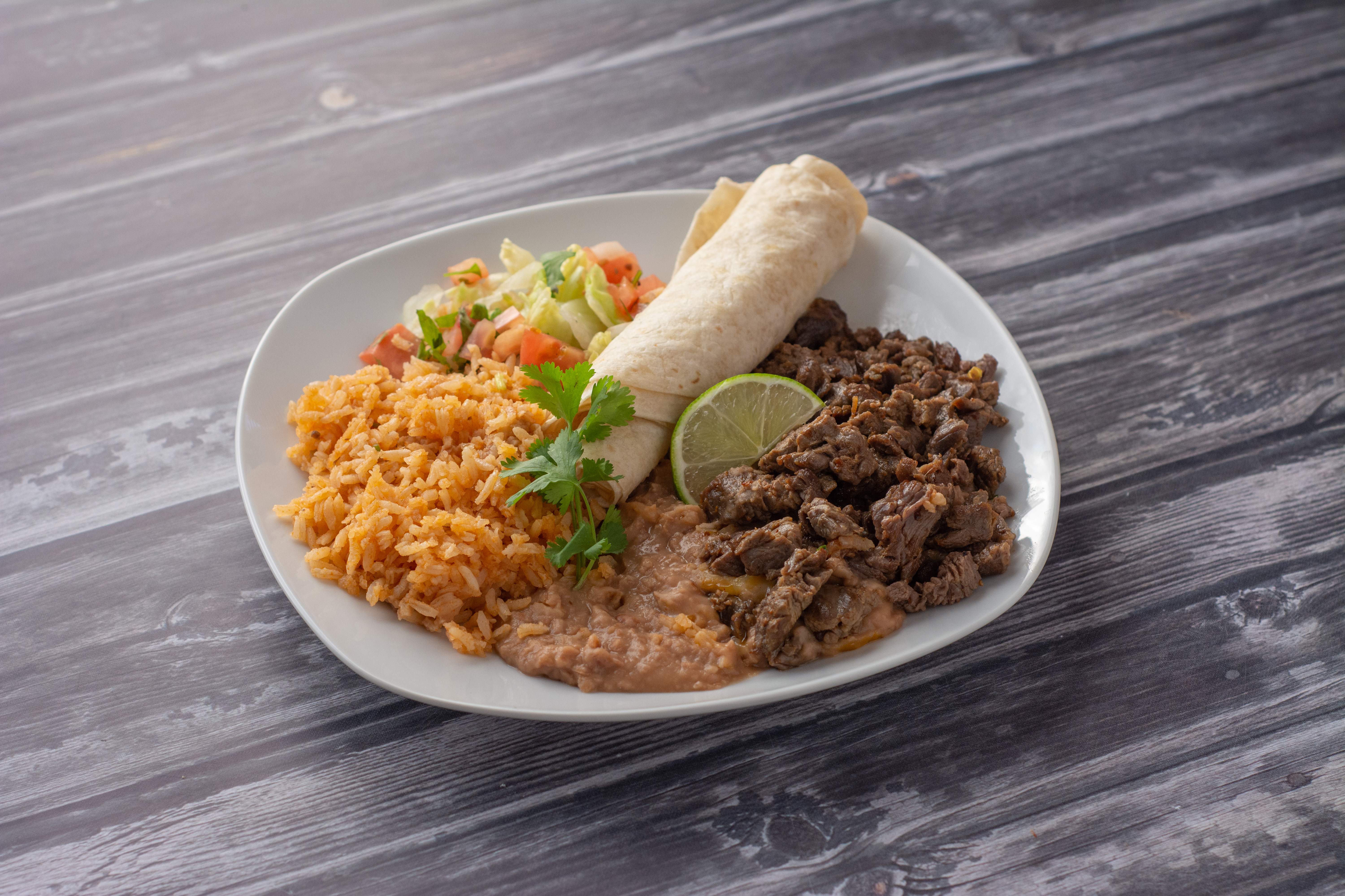 Order 19. Carne Asada, Rice and Beans Dinner food online from Rosa's Restaurant store, Hermosa Beach on bringmethat.com