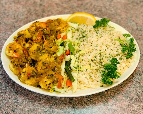 Order Curried Shrimp and Plan Rice food online from Caribbean Delight store, Omaha on bringmethat.com