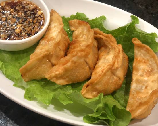 Order Pork Dumpling (4pcs) food online from Thai.Pho store, Forney on bringmethat.com