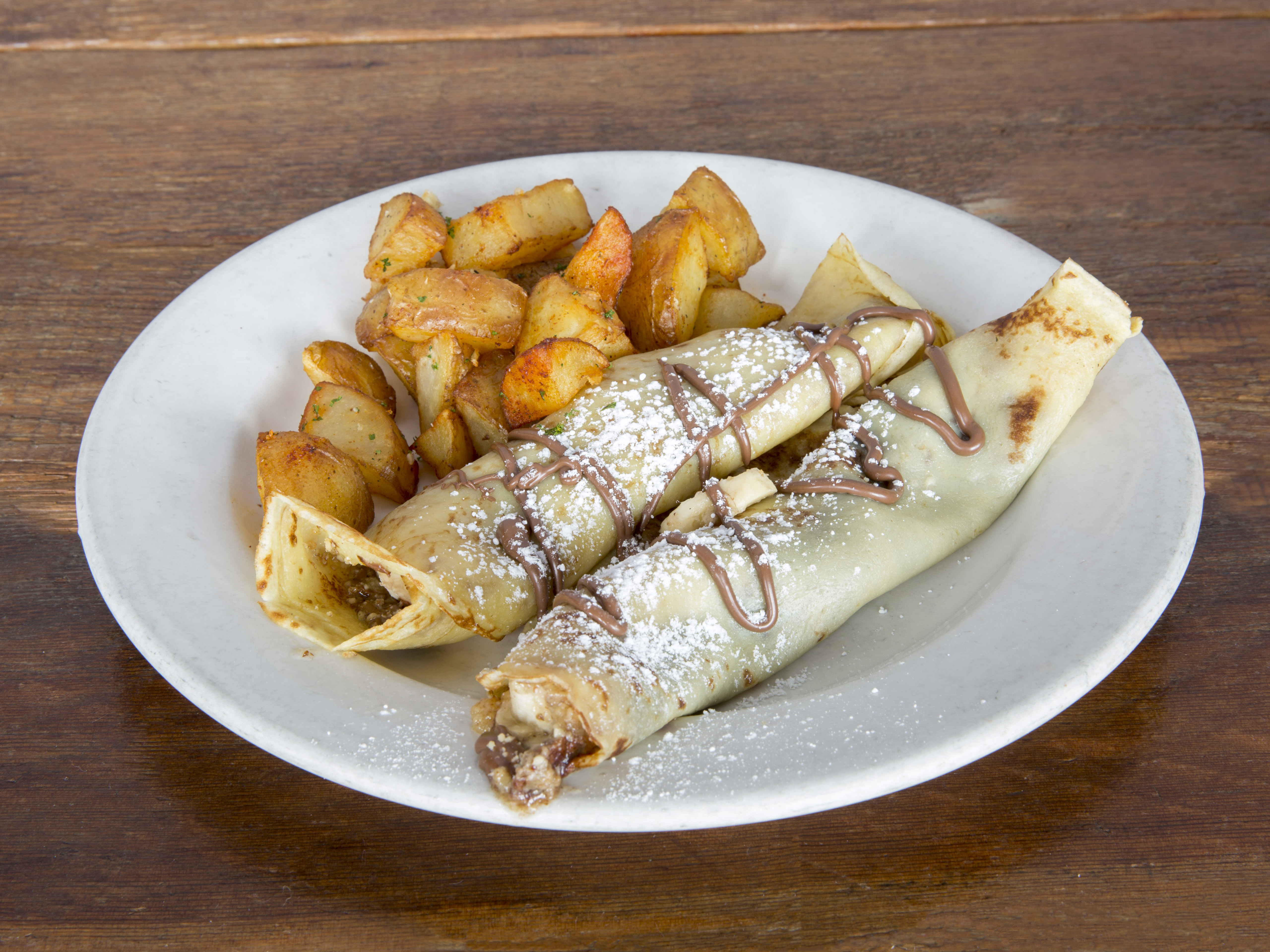 Order  Bananas, Nutella, Candied Walnuts, and Sweet Butter Crepe food online from Bon Vivant Market And Café store, Los Angeles on bringmethat.com