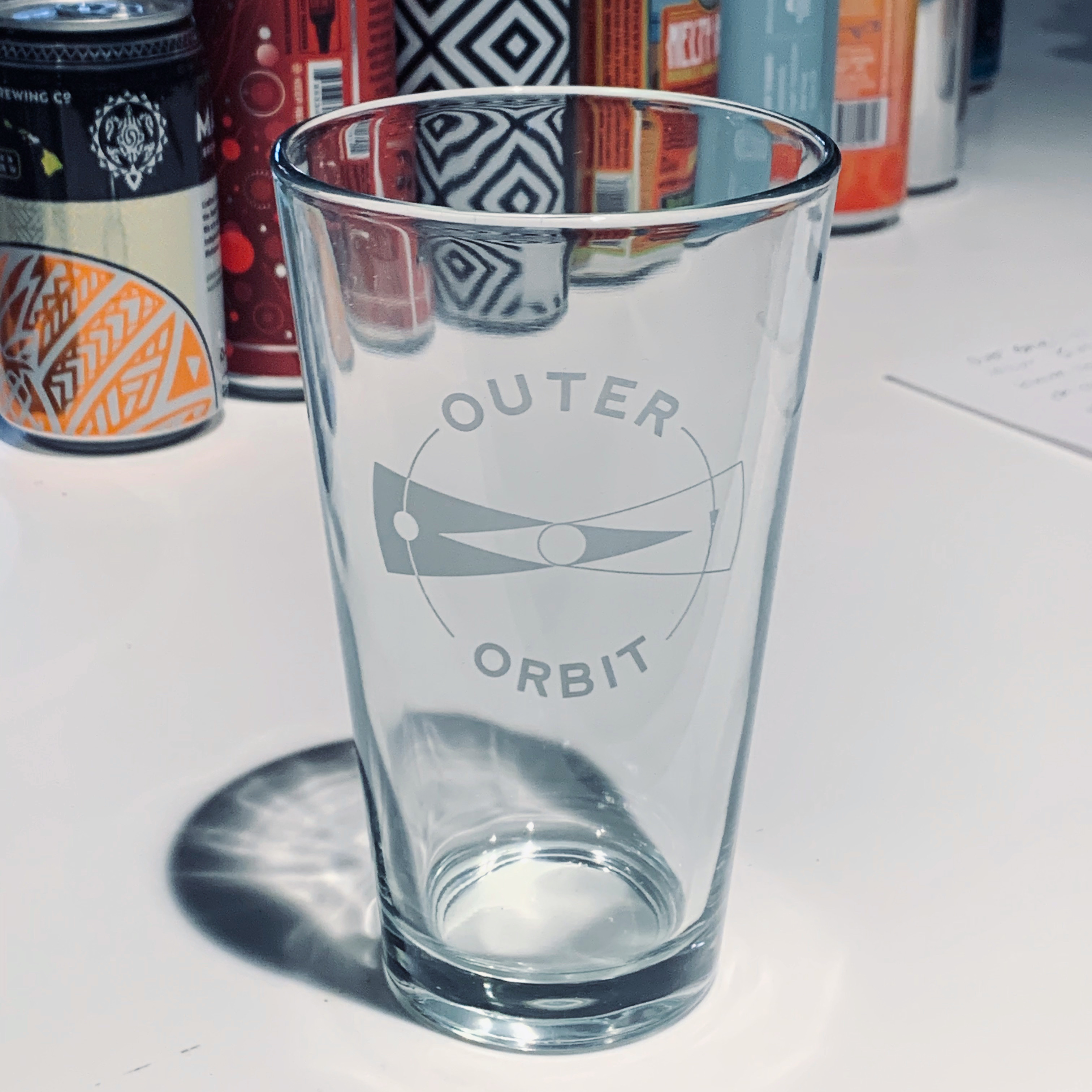 Order Pint Glass w/Logo food online from Outer Orbit store, San Francisco on bringmethat.com