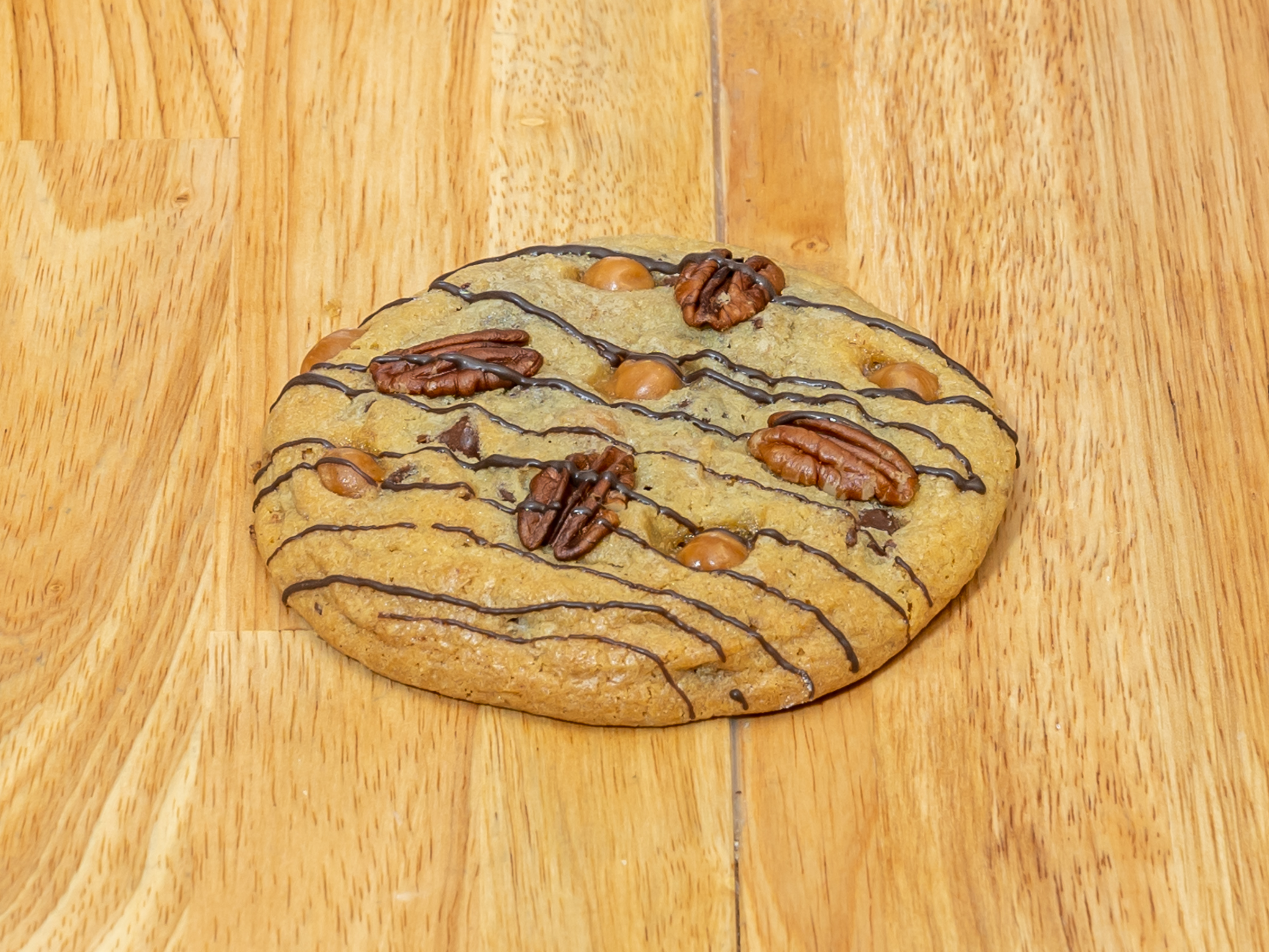 Order 5 oz. Turtle Infused Cookie food online from Mary's Mountain Cookies store, McKinney on bringmethat.com