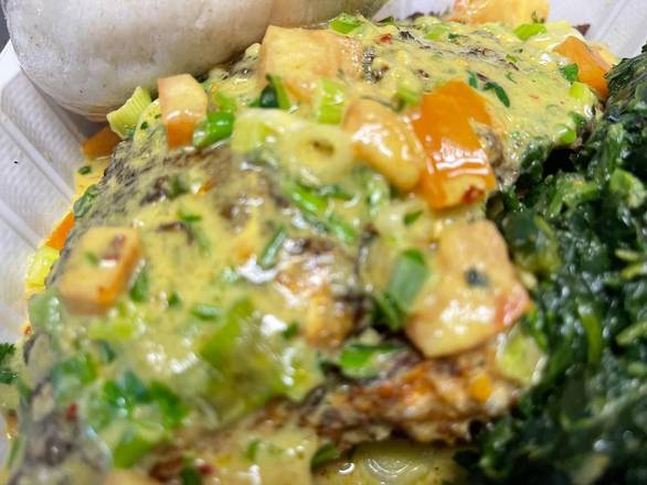 Order Tilapia in coconut-curry sauce, greens with Ugali food online from Kilimanjaro Grill store, Minneapolis on bringmethat.com