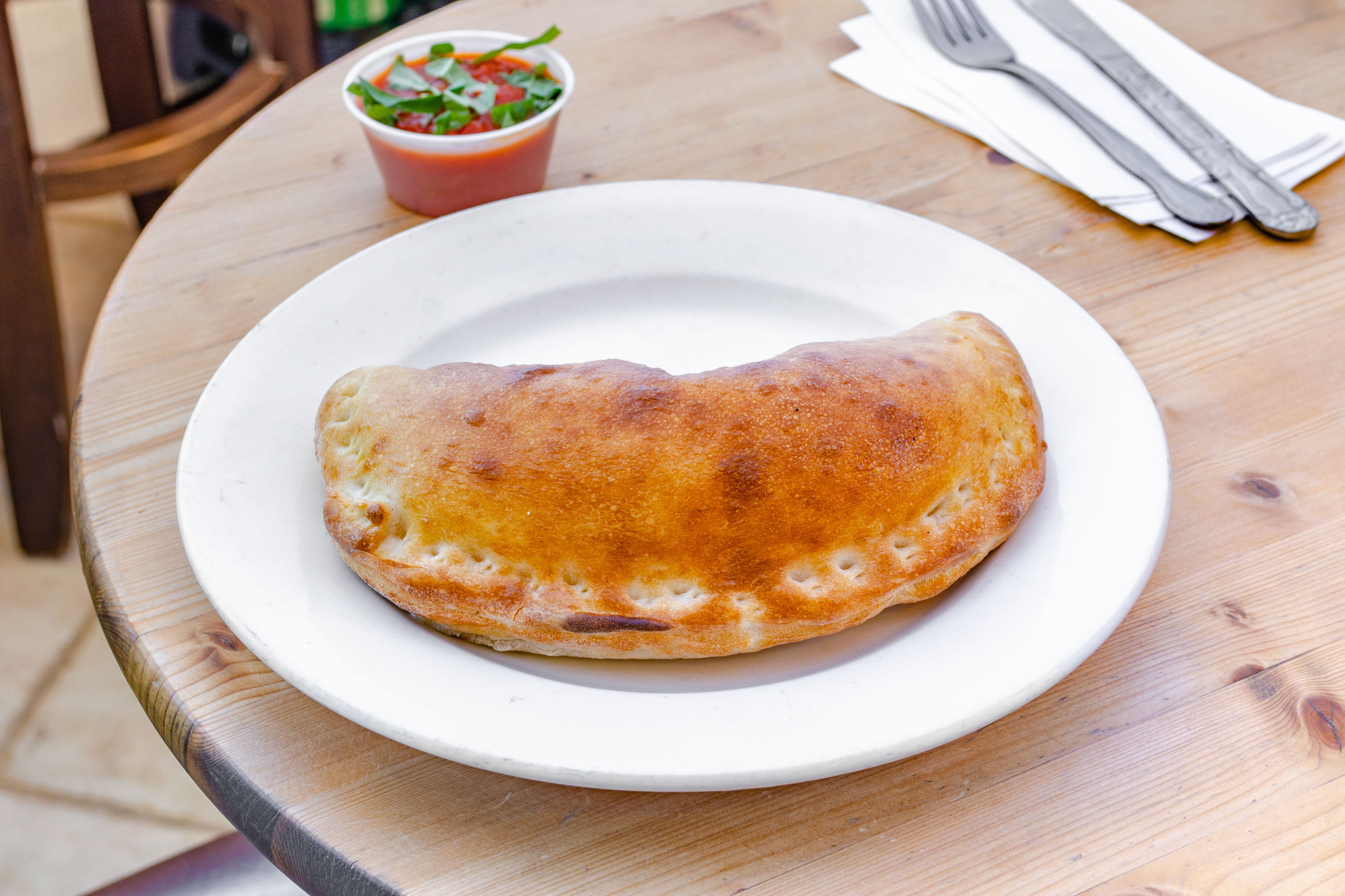 Order Three Cheese Calzone - Calzone food online from Pizza Station store, Katonah on bringmethat.com