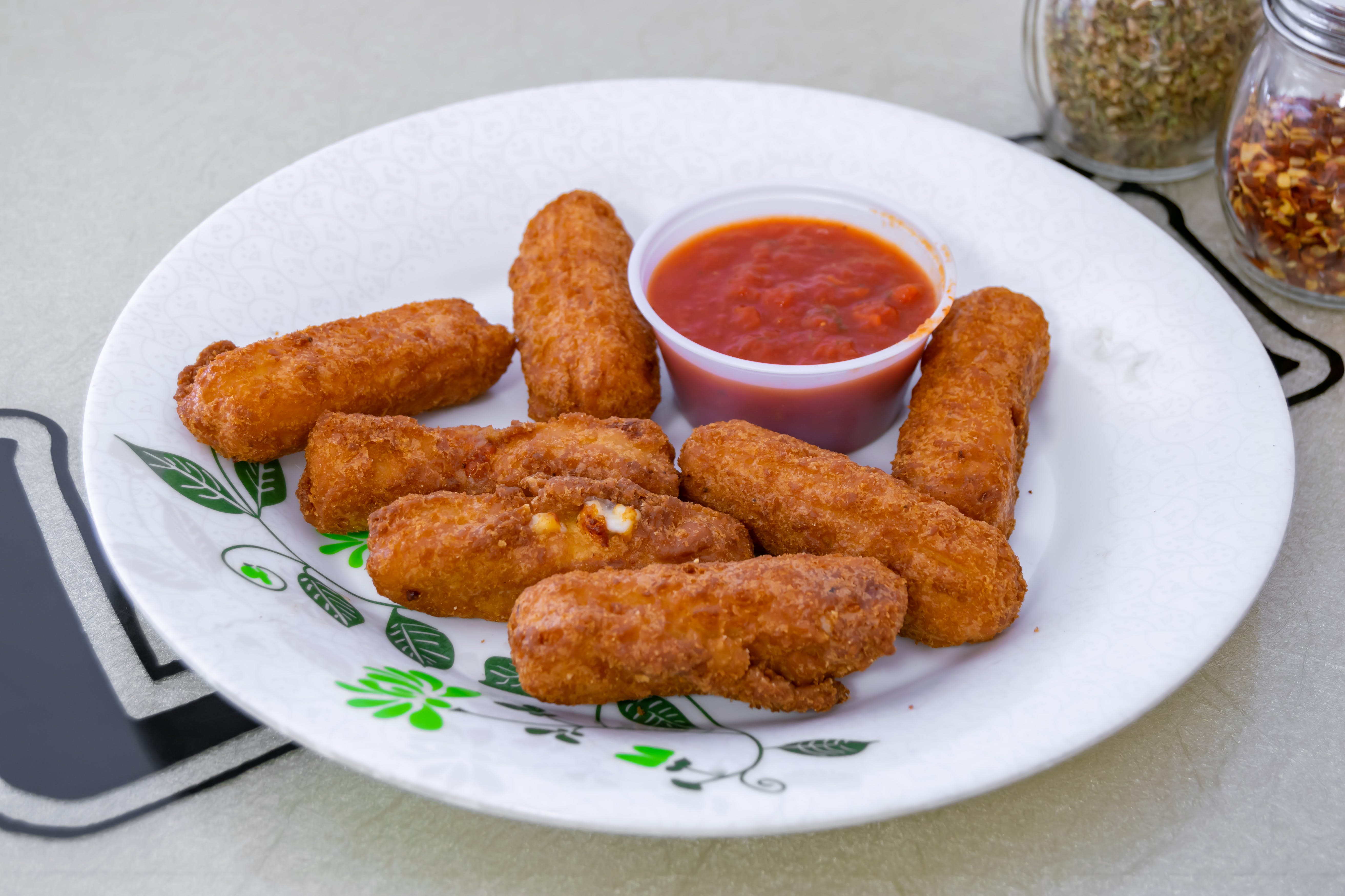 Order Mozzarella Sticks - 7 Pieces food online from Luigi New York Style Pizza store, South Plainfield on bringmethat.com
