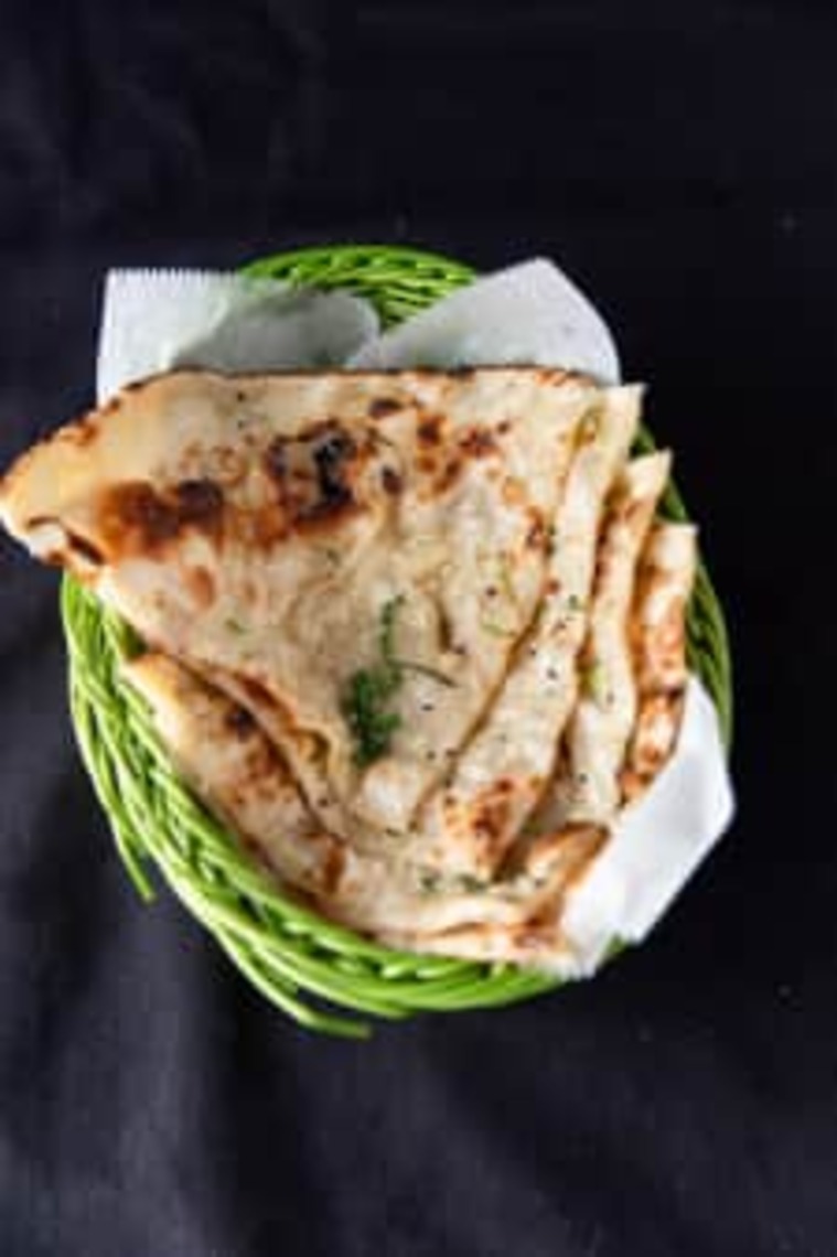 Order Garlic Naan food online from Holi Indian Grill store, Panama City on bringmethat.com