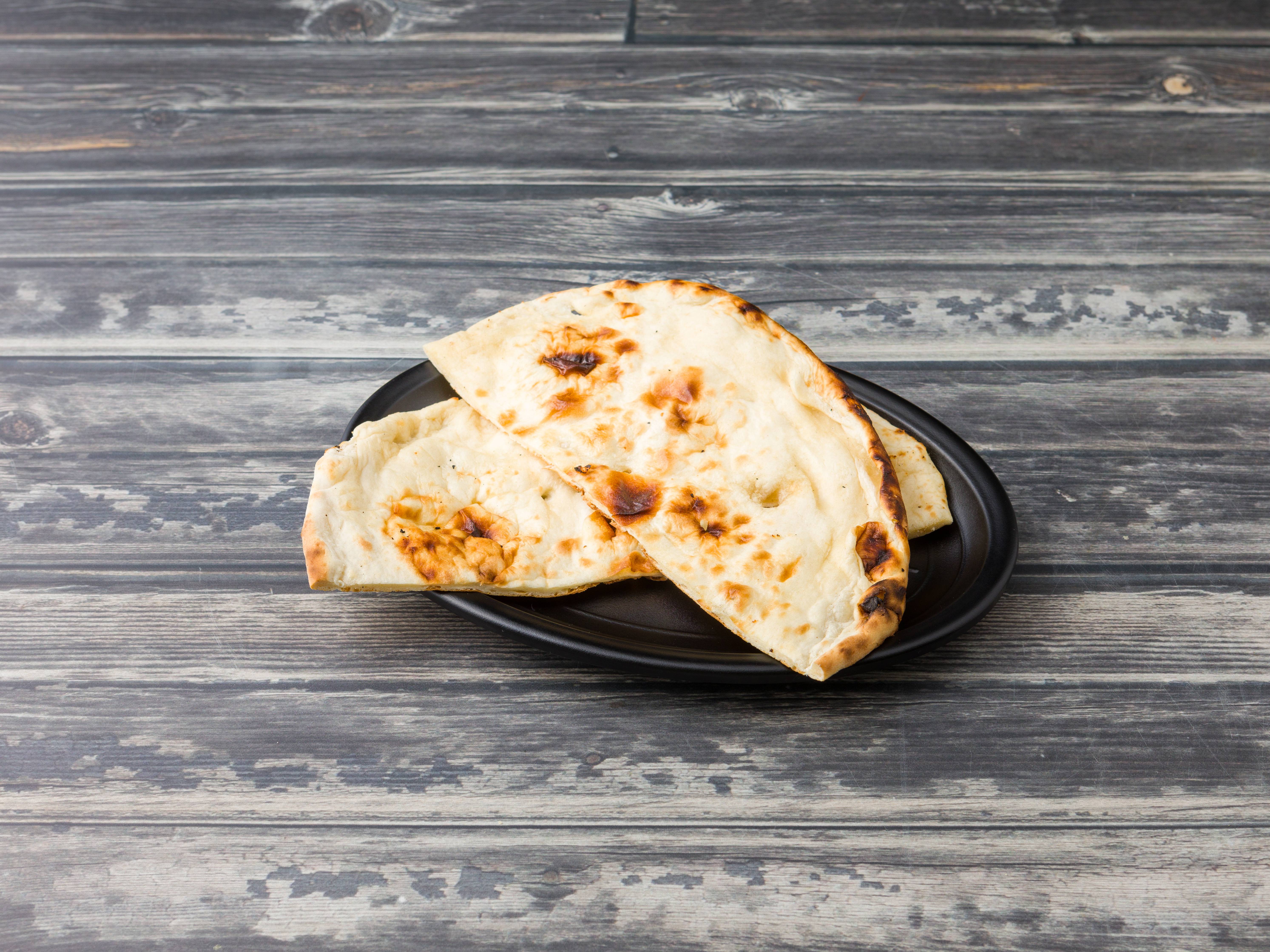 Order Naan food online from Chaska Fine Indian Cuisine store, Jersey City on bringmethat.com