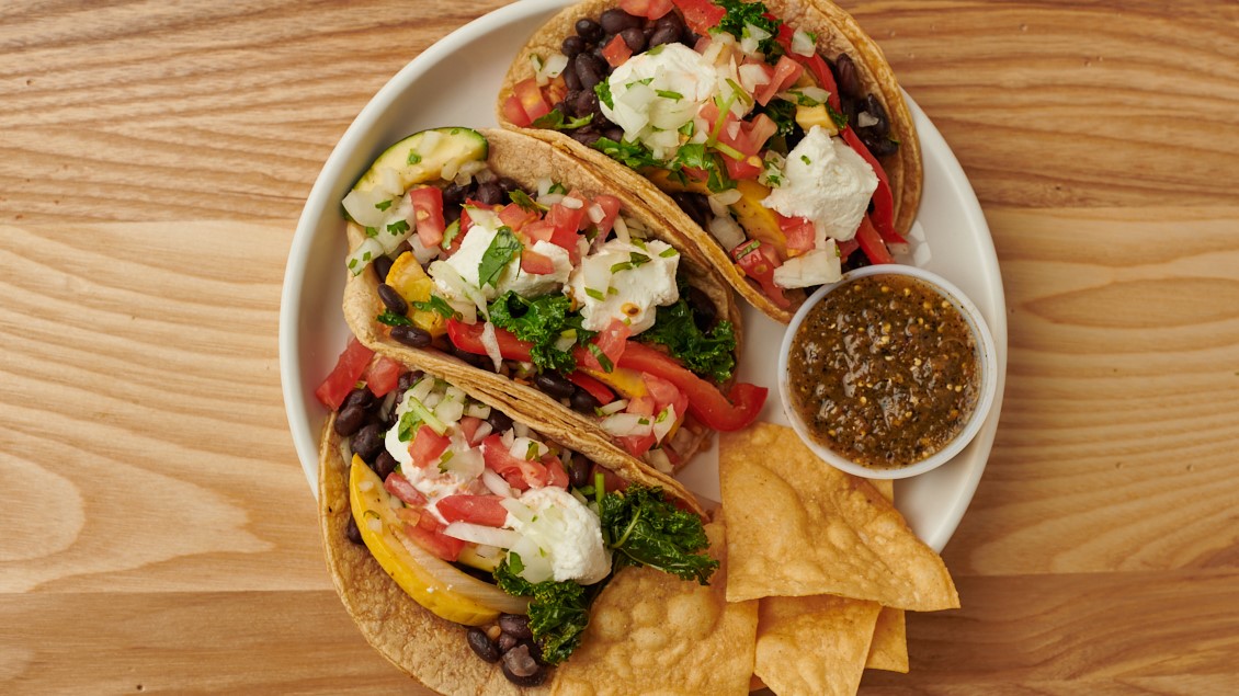 Order GOAT CHEESE & BLACK BEAN TACOS* food online from Burrito Beach store, Chicago on bringmethat.com