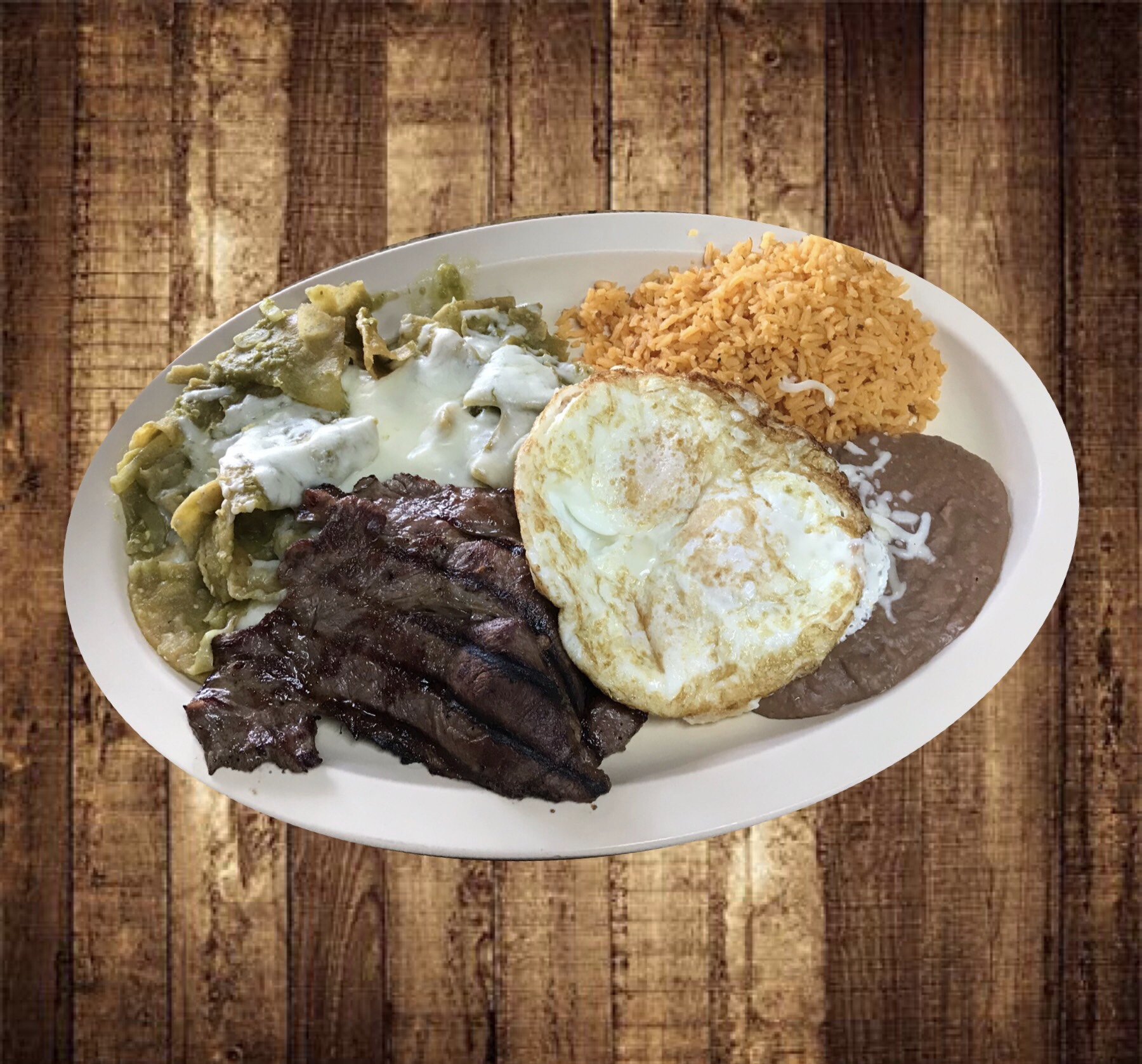 Order Chilaquiles with Egg & Steak food online from Taqueria Los Paisanos store, Joliet on bringmethat.com