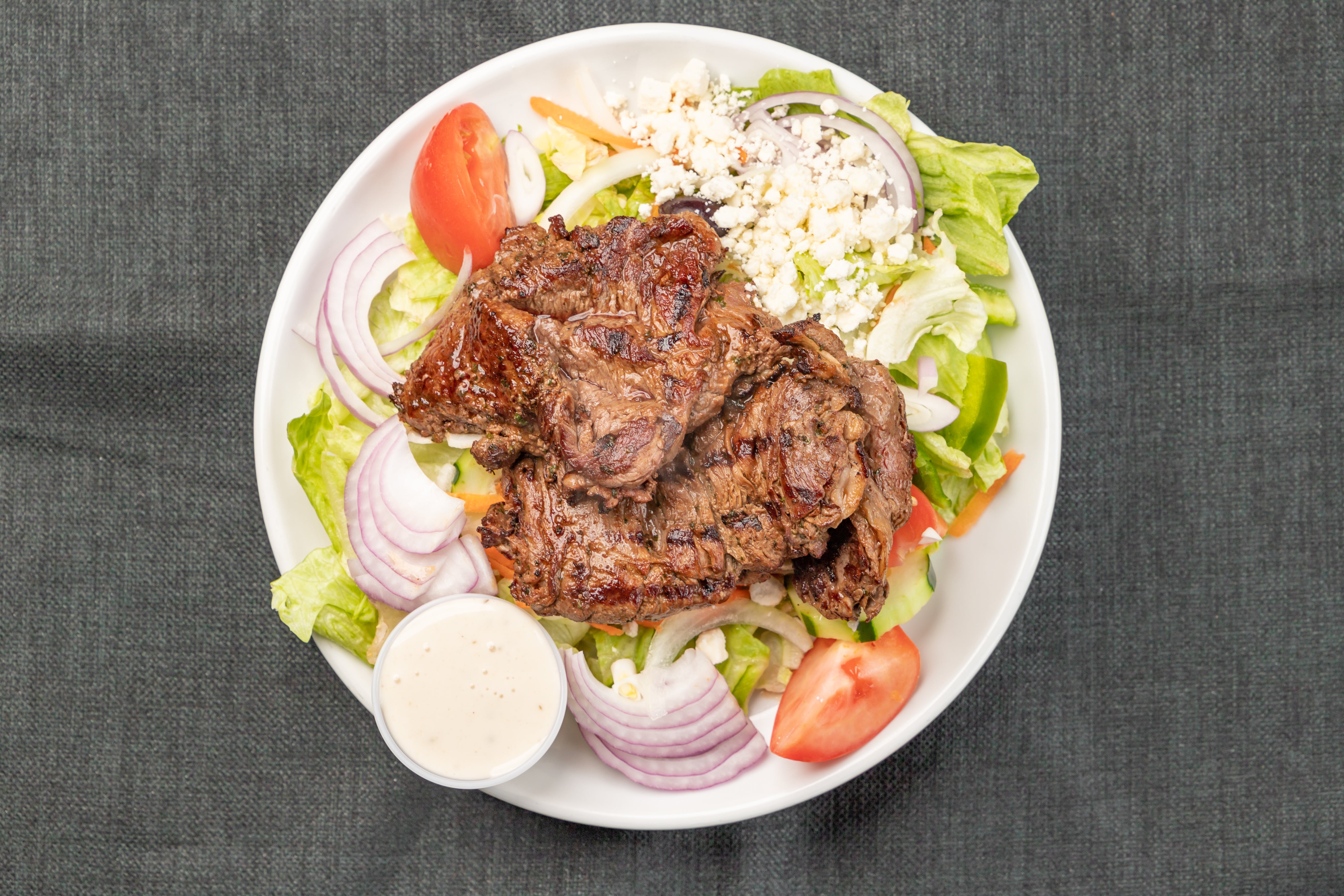 Order Steak Tip Salad - Salad food online from The Avenue Grille and Pizzeria store, Dorchester on bringmethat.com