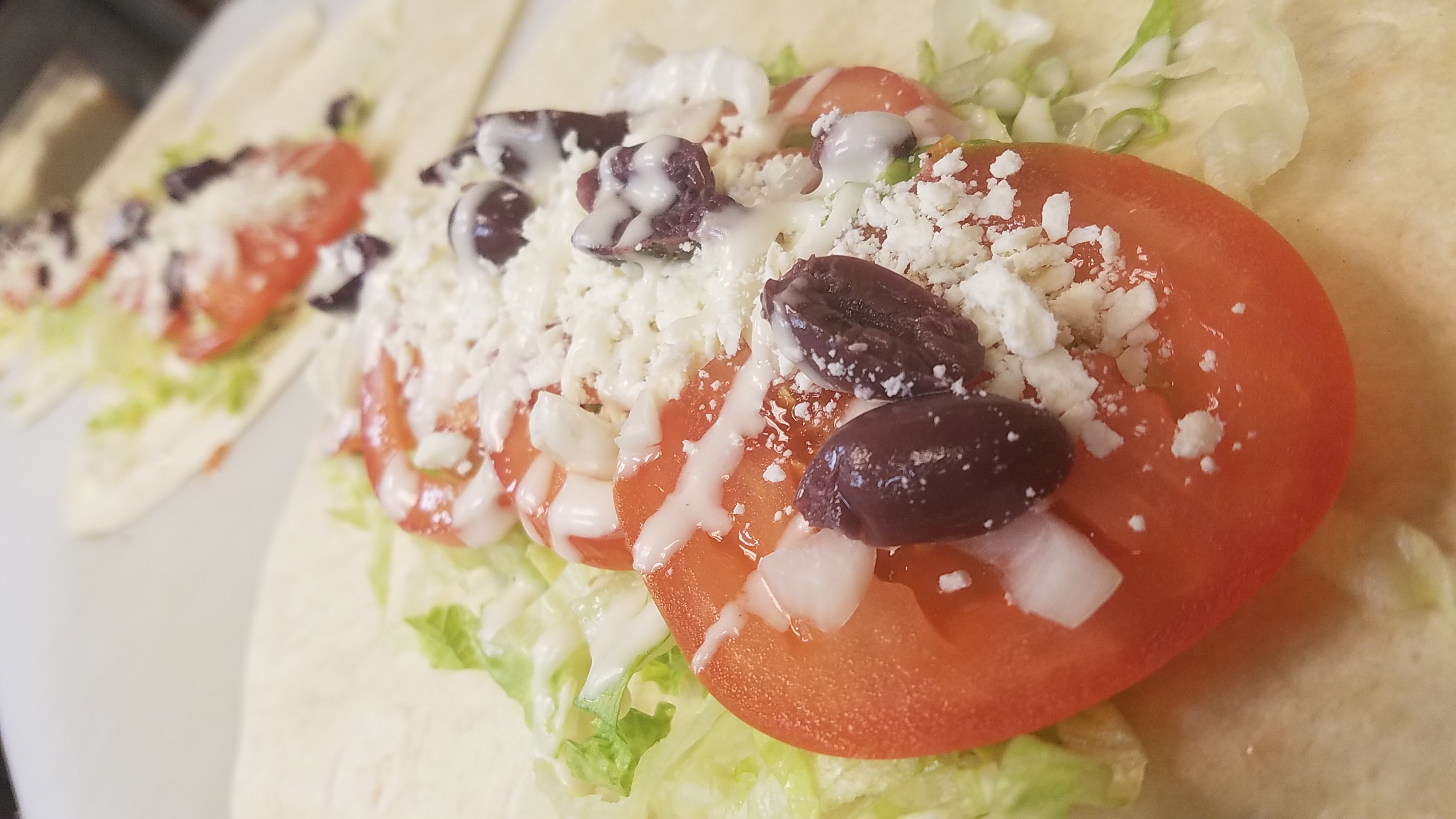 Order Greek Wrap food online from Gregory House Of Pizza store, Belmont on bringmethat.com