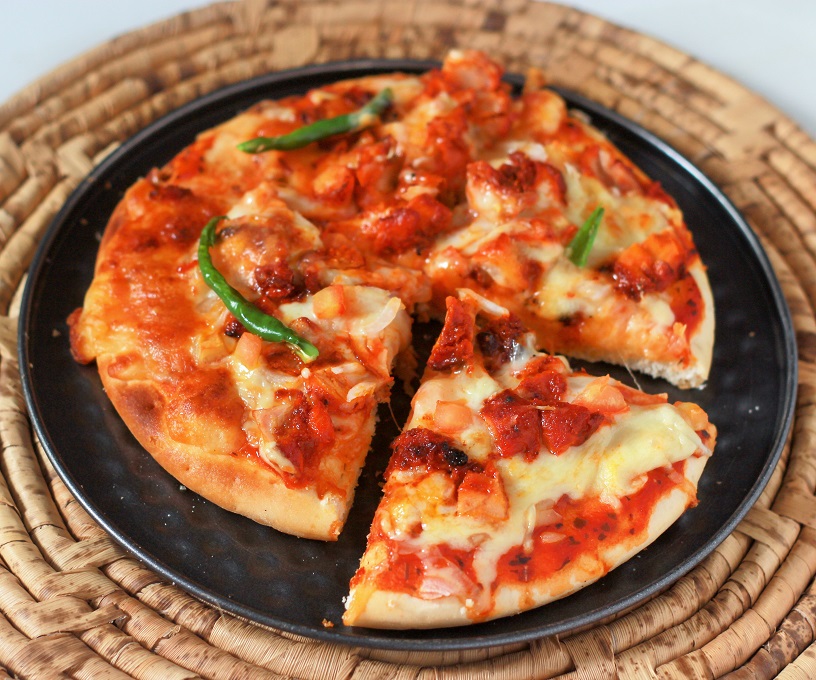 Order Chicken Tikka Pizza food online from Pizza Belly store, Katy on bringmethat.com