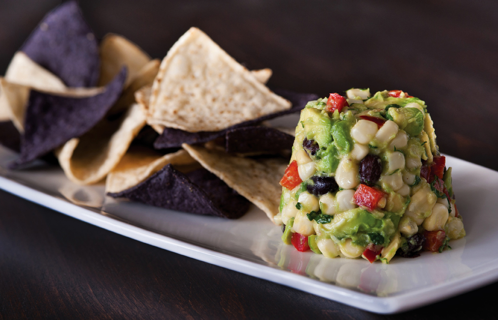 Order White Corn Guacamole and Chips Plate  food online from California Pizza Kitchen - River City Dr store, Jacksonville on bringmethat.com