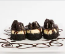 Order 1 Dozen Cookies & Cream Cheesecake Minis  food online from Masterpiece Desserts store, Houston on bringmethat.com