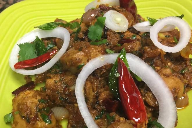 Order Naatu Koli Varuval food online from Nala’S Indian Restaurant store, Austin on bringmethat.com
