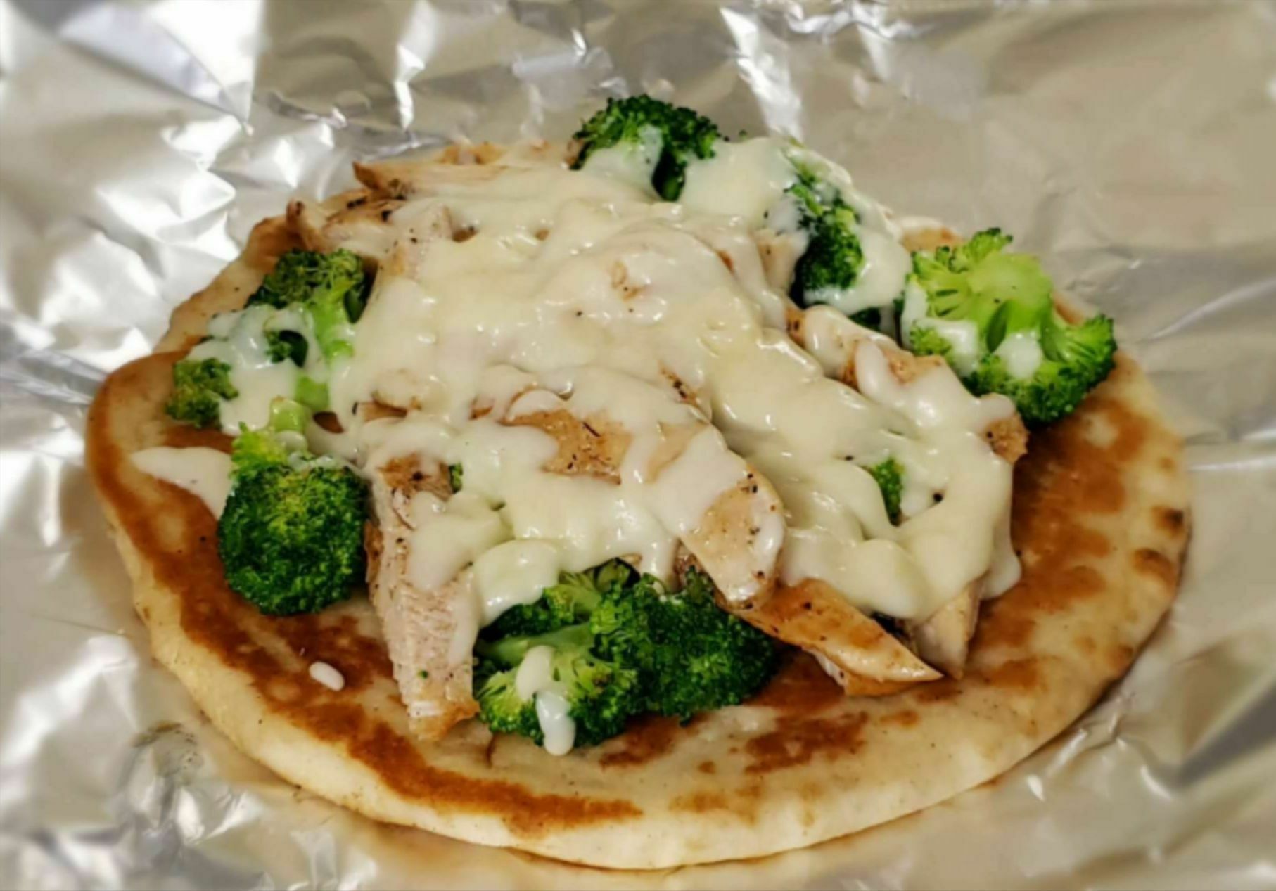 Order Chicken and Broccoli Stuffed Pita food online from A Cut Above Deli store, Canton on bringmethat.com