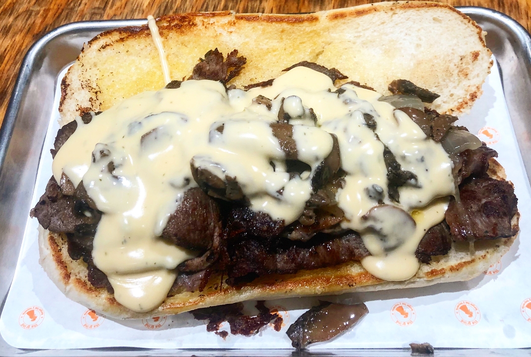 Order *TEXXAS CHEESE STEAK food online from The Grind Burger Bar store, The Colony on bringmethat.com