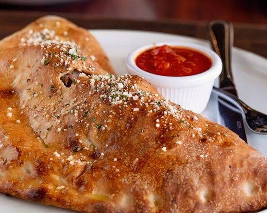 Order New York Calzone food online from New York Pizzeria store, Houston on bringmethat.com