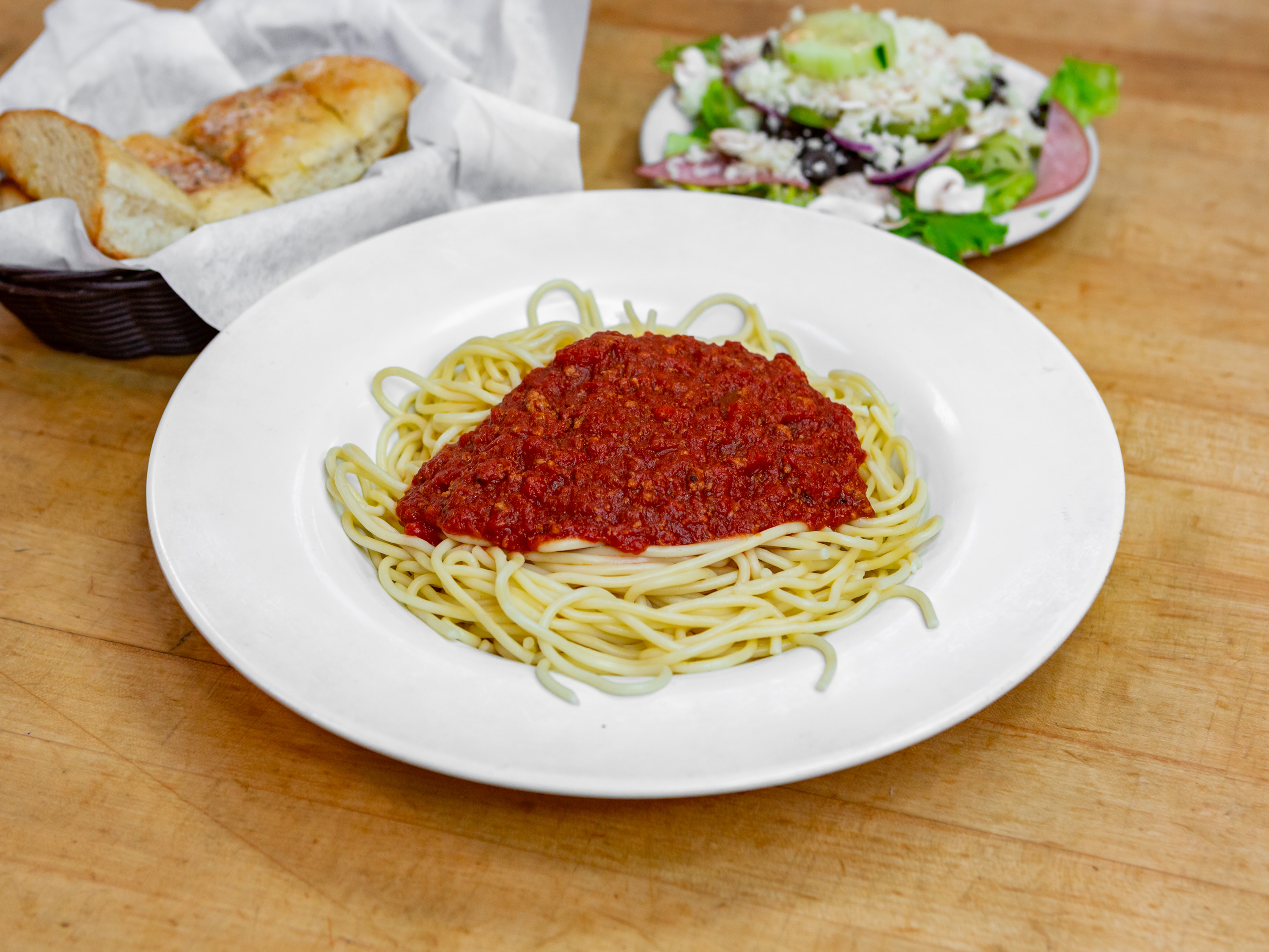 Order Spaghetti with Meat Sauce Dinner food online from Guidos Pizza store, Anchorage on bringmethat.com