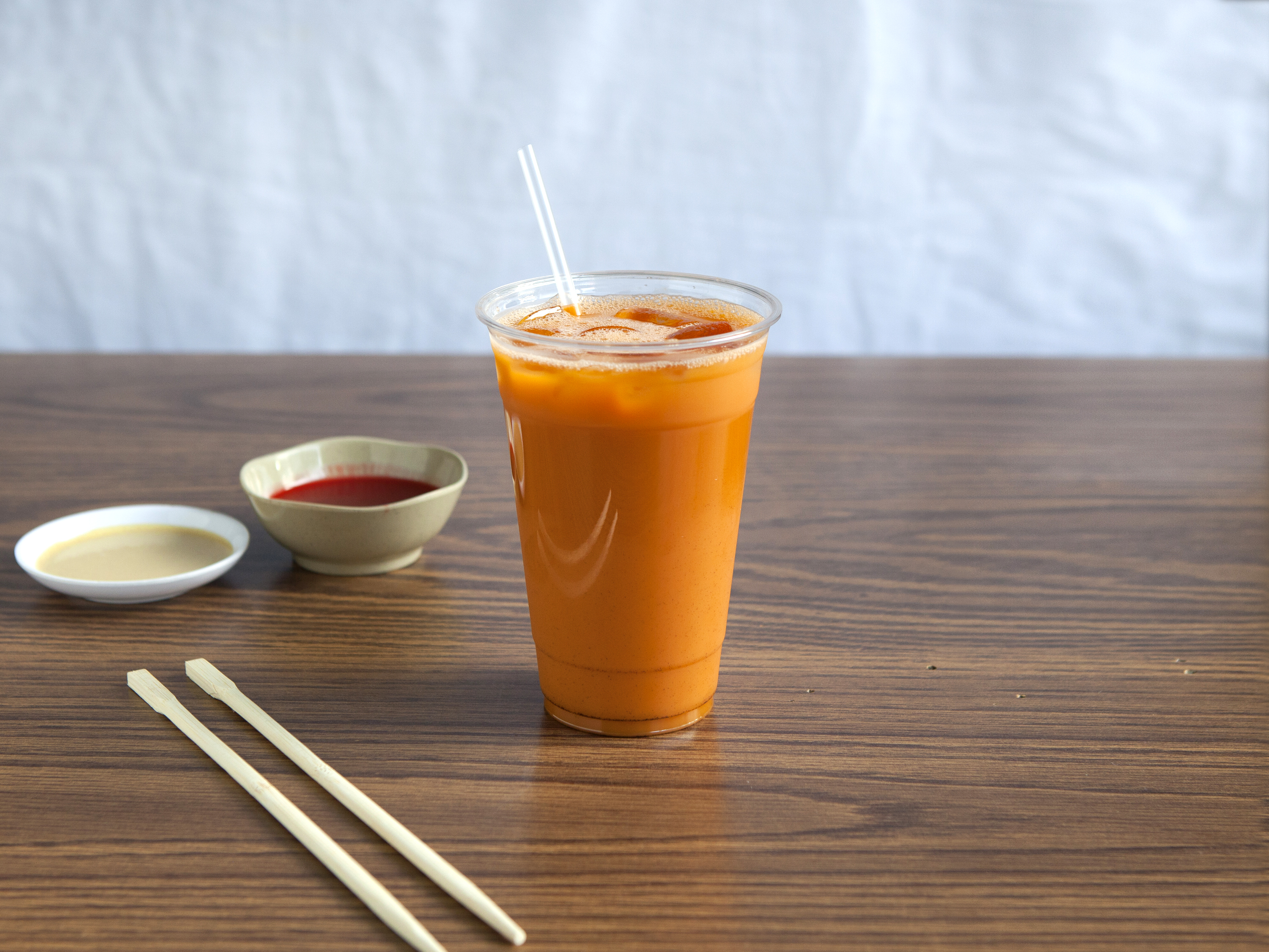 Order 20 oz. Cup of Thai Tea food online from Kim's Restaurant store, Los Angeles on bringmethat.com