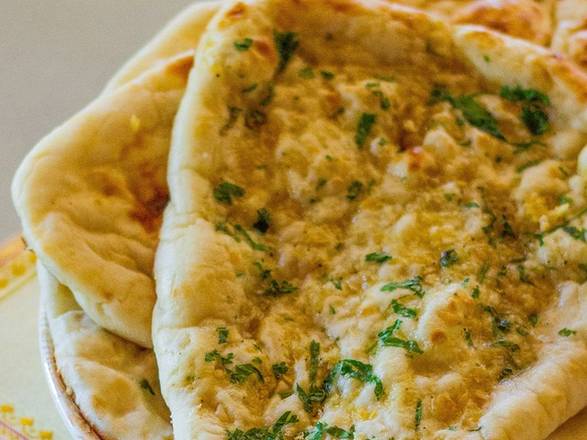 Order Garlic Naan food online from Passage to India store, Cambridge on bringmethat.com