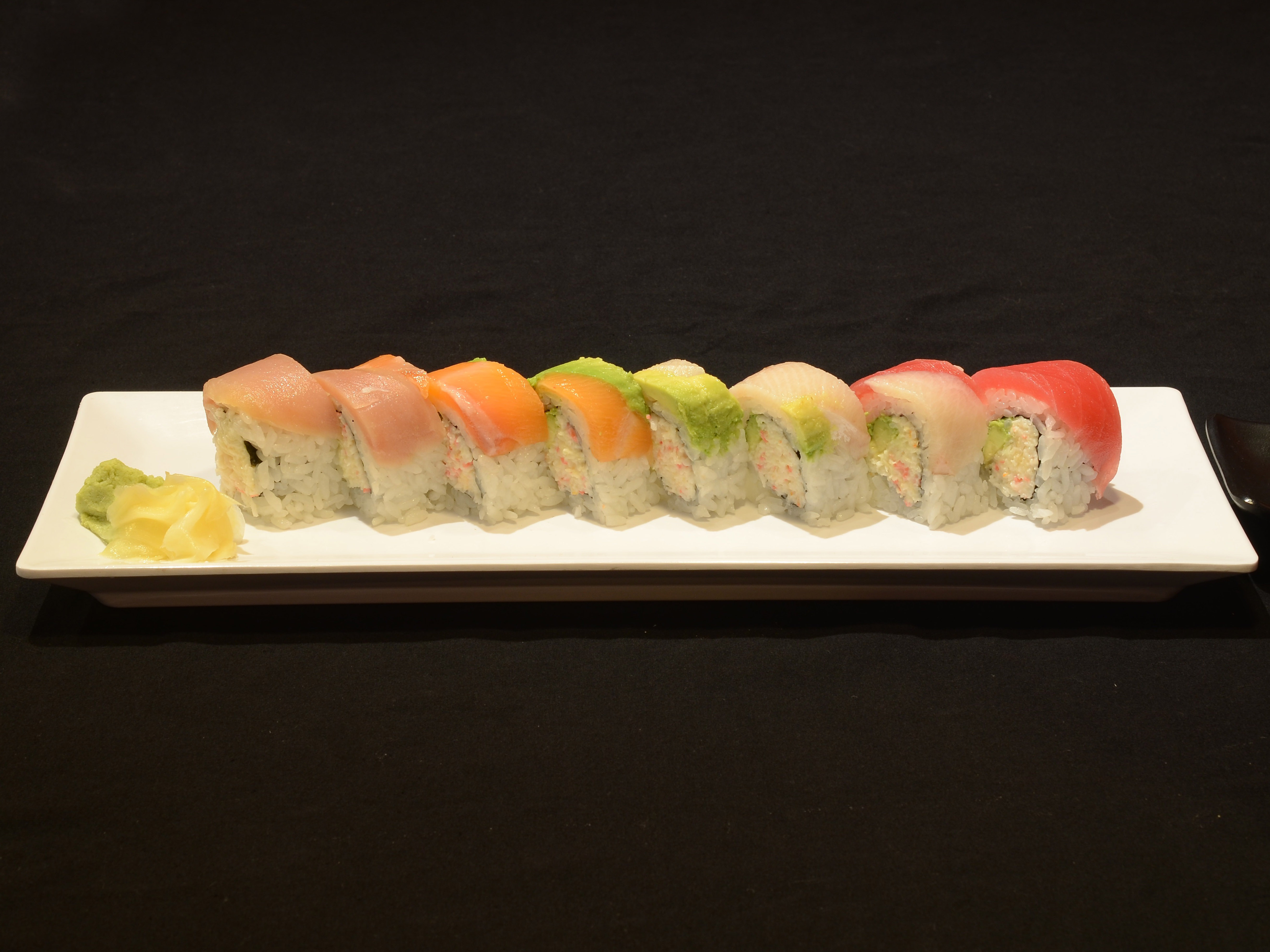 Order Rainbow Roll food online from Yoshio Sushi store, El Cerrito on bringmethat.com
