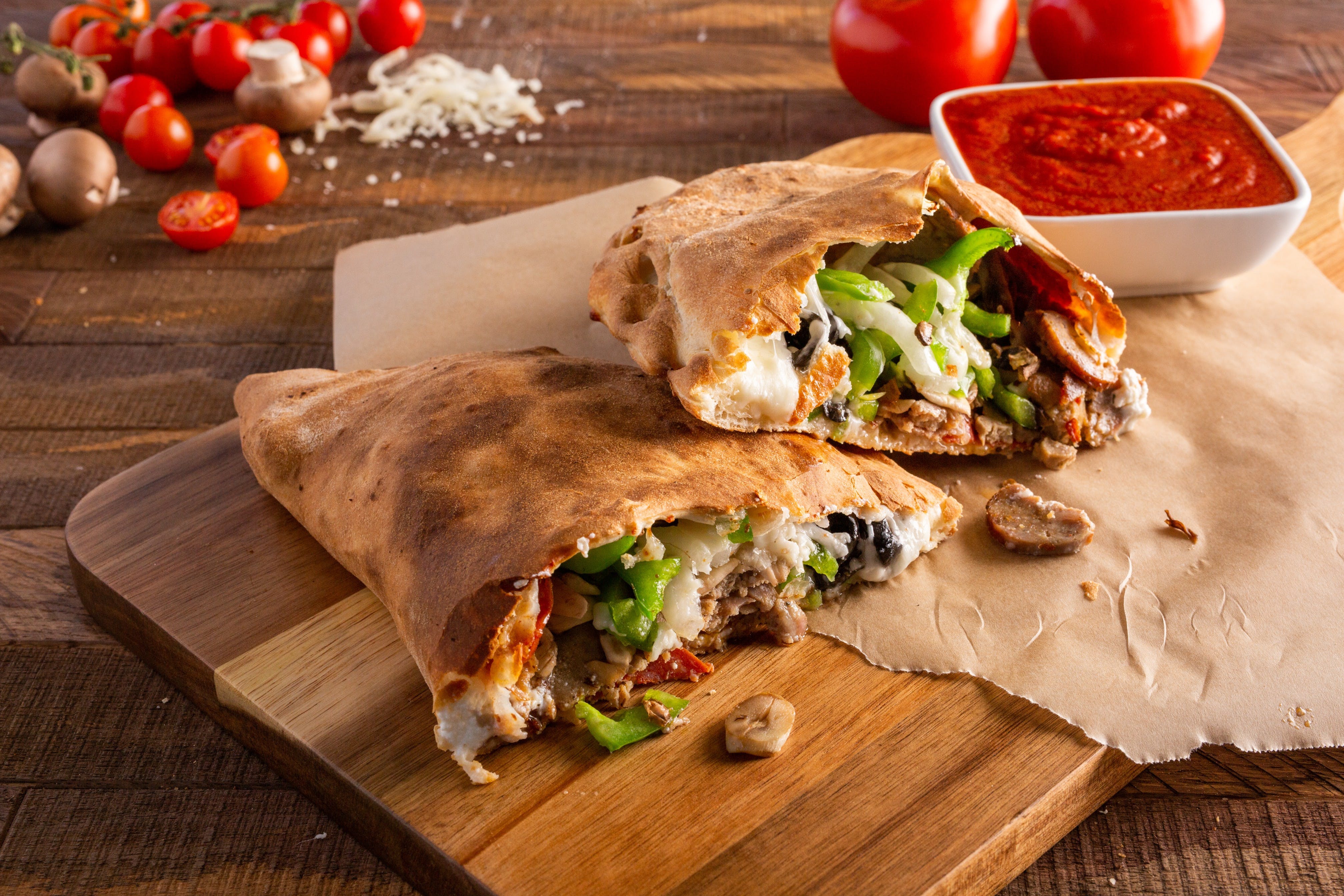 Order Deluxe Calzone - Calzone food online from Ameci Pizza & Pasta store, Glendale on bringmethat.com