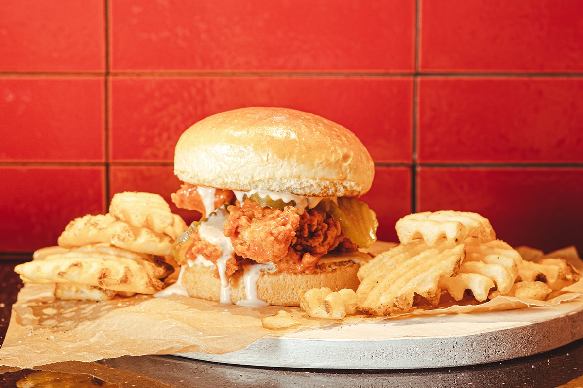 Order NASHVILLE HOT TWISTED TENDER SANDWICH food online from Old Chicago Pizza + Taproom store, Waco on bringmethat.com