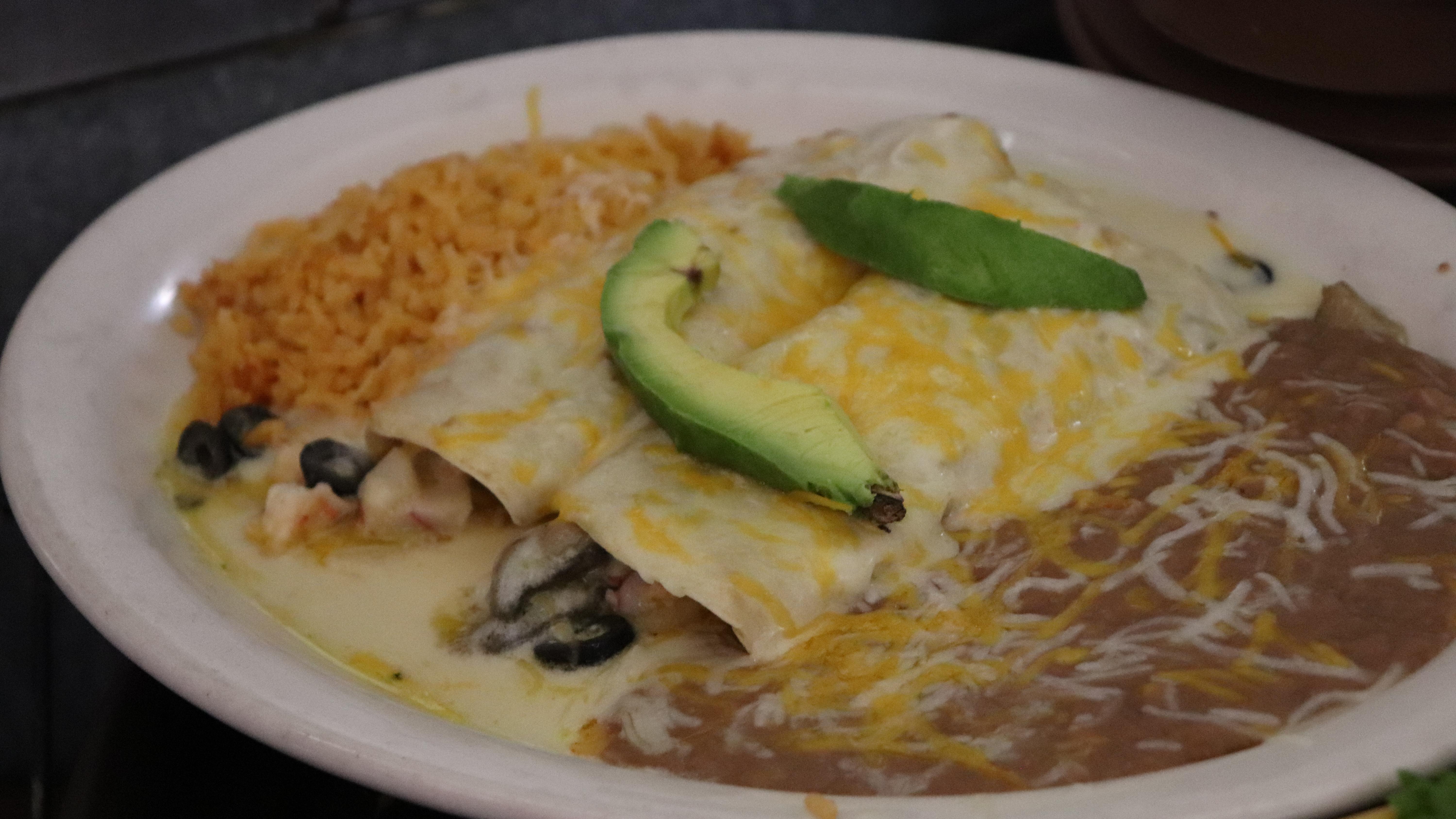 Order Seafood Enchiladas food online from Iguana Grill & Cantina store, Bakersfield on bringmethat.com