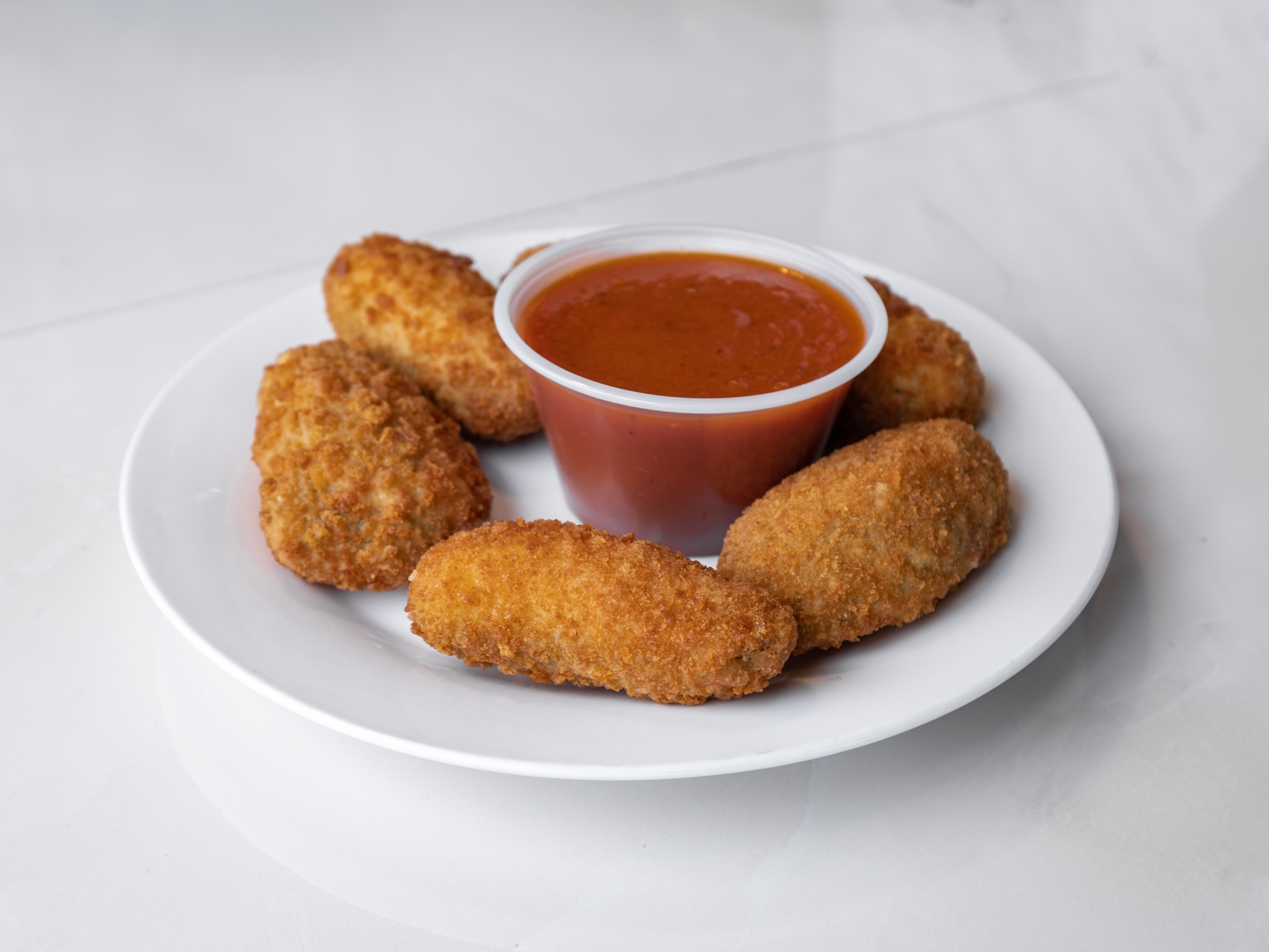 Order 6 Piece Jalapeno Poppers food online from New Yorker Pizza store, Leesburg on bringmethat.com