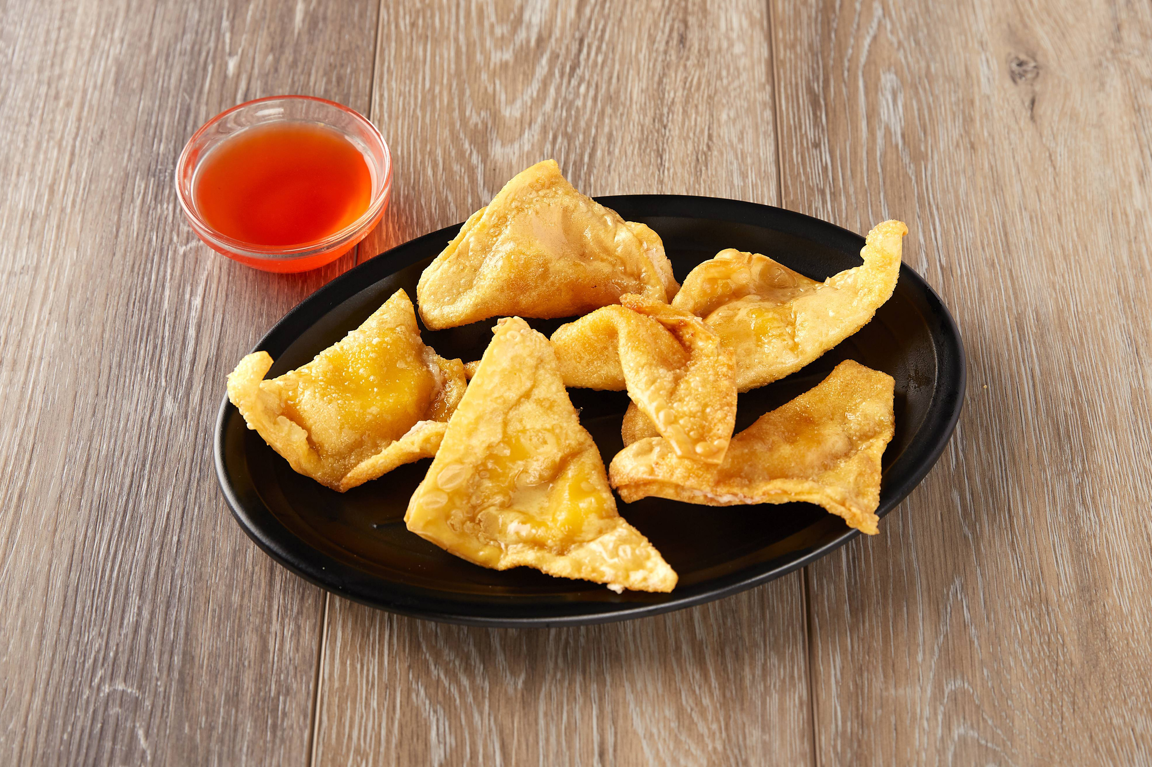Order 6 Piece Crab Rangoon food online from China House store, Norfolk on bringmethat.com