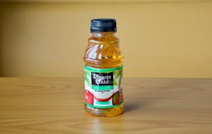 Order Apple Juice - 10oz  food online from Daylight Donuts Op store, Overland Park on bringmethat.com