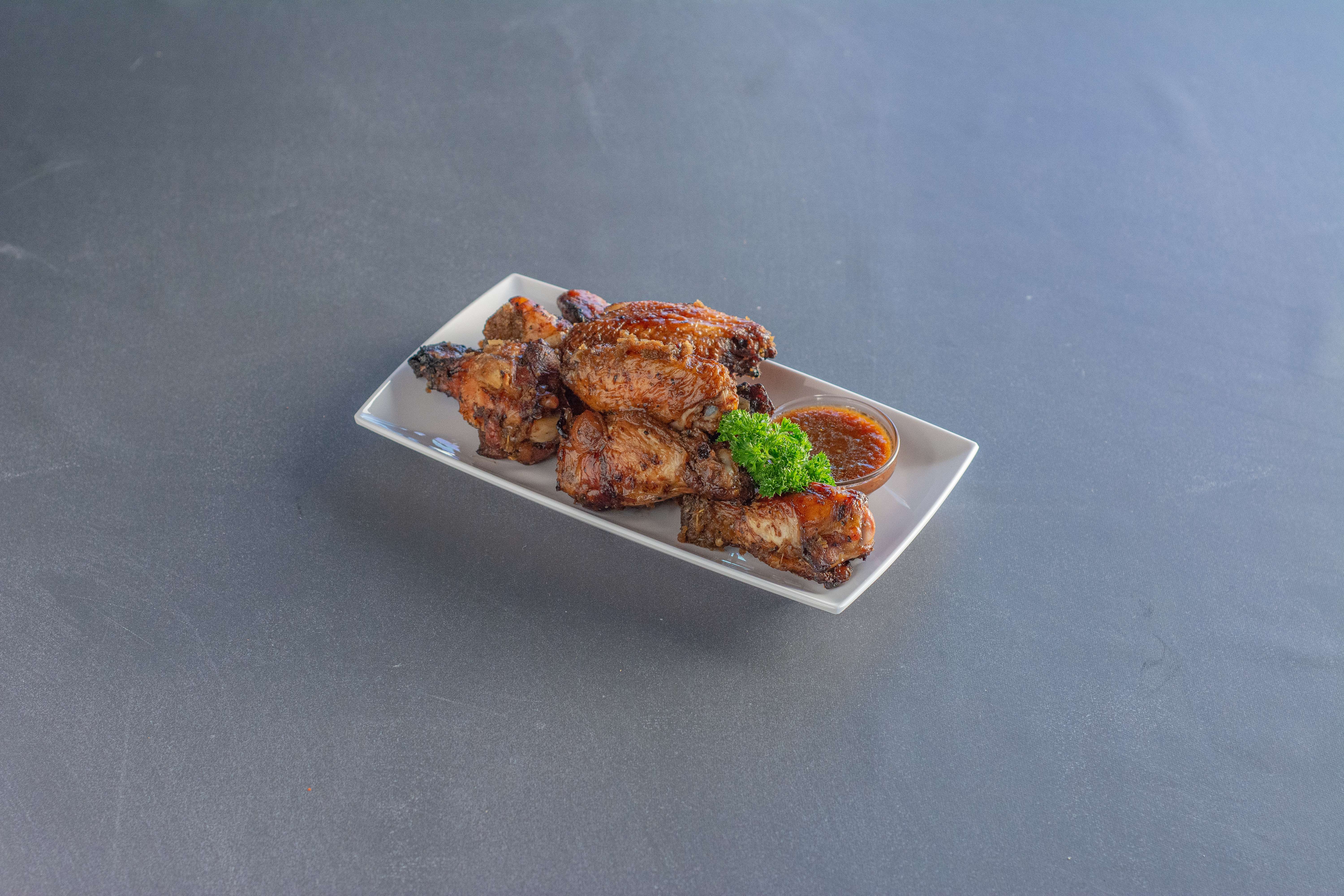 Order Jerk Chicken Wings food online from Flavas Jamaican Grill store, South San Francisco on bringmethat.com