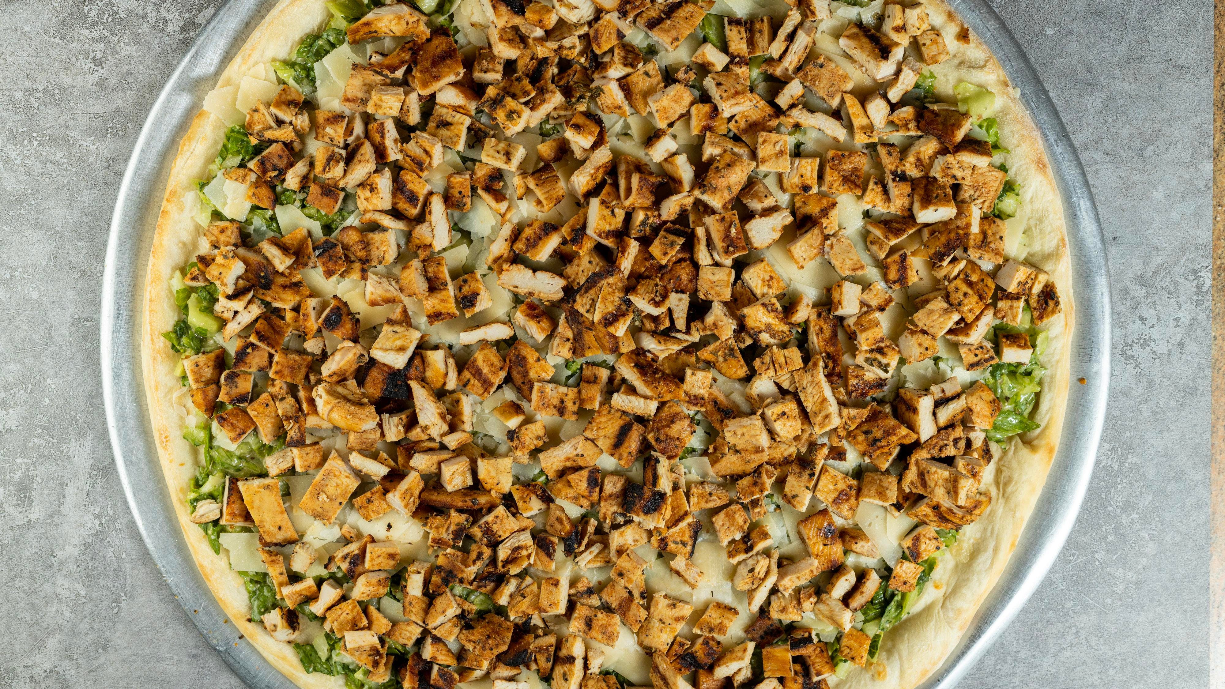 Order Grilled Chicken Caesar Pizza - Mini Personal food online from Regina Pizza store, Lynbrook on bringmethat.com
