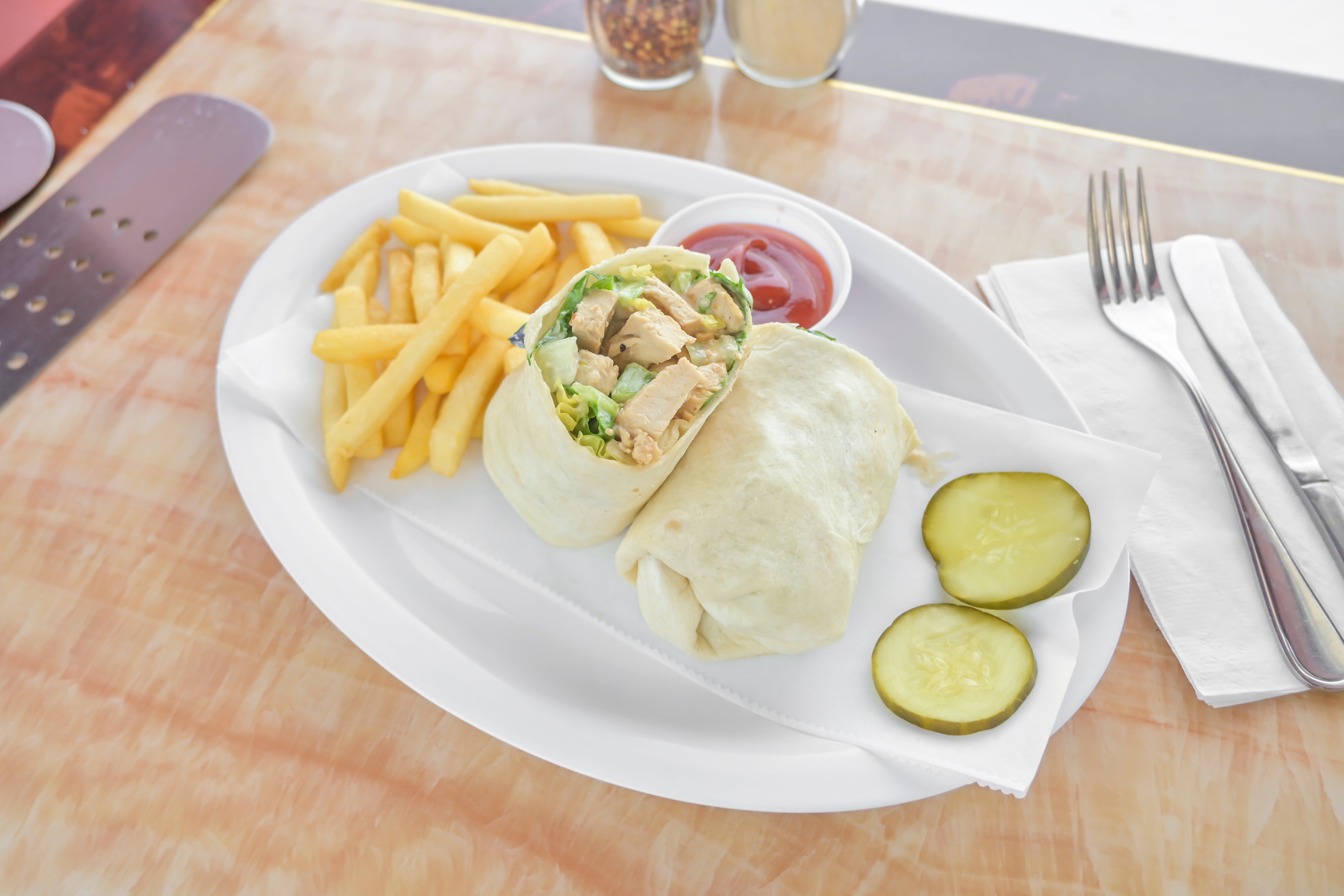 Order Chicken Caesar Wrap - Wrap food online from Tuscan Pizza store, Sicklerville on bringmethat.com